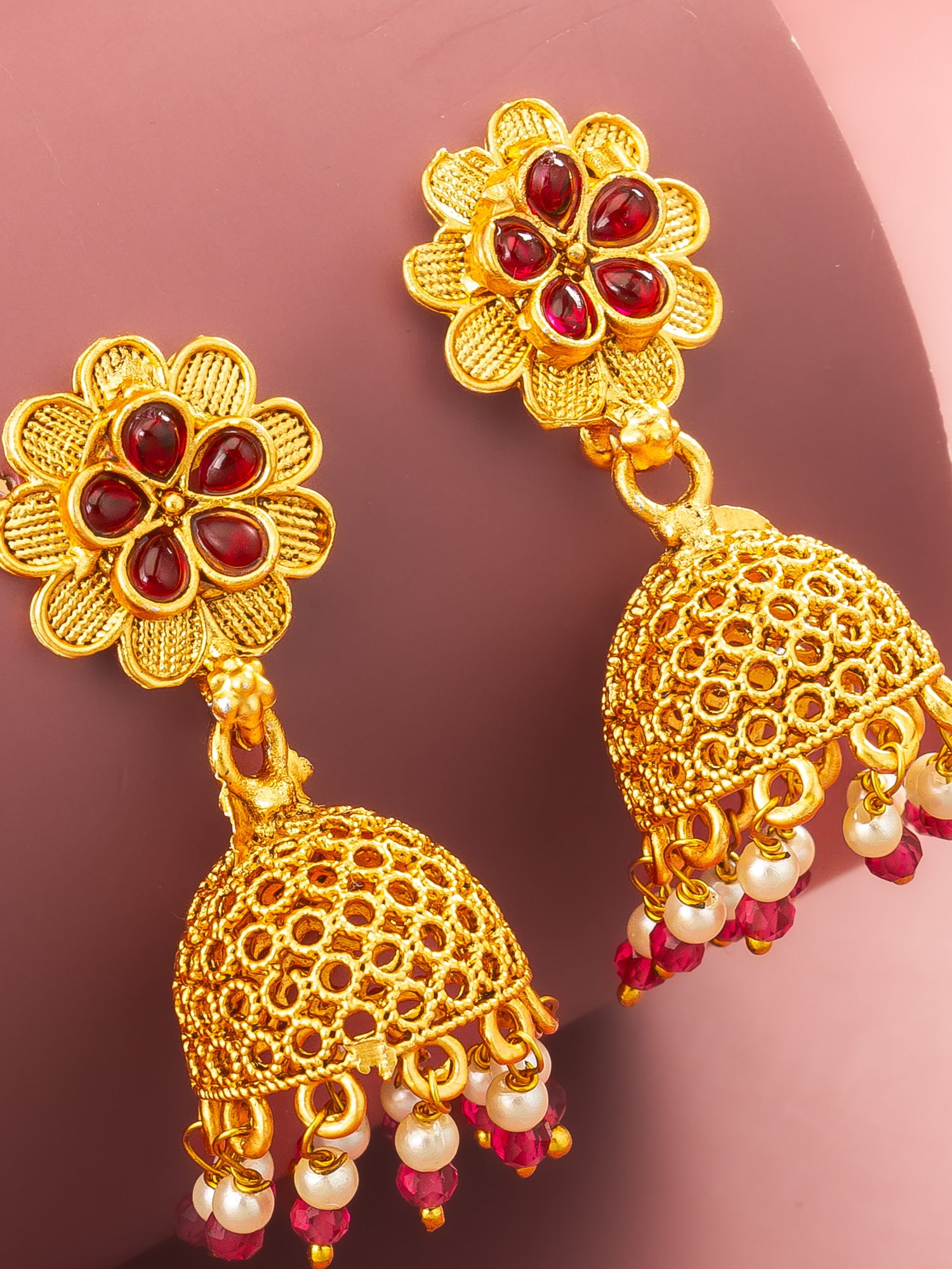 Aadita Gold Plated Floral Jhumka Earrings with Pink Stone Accents