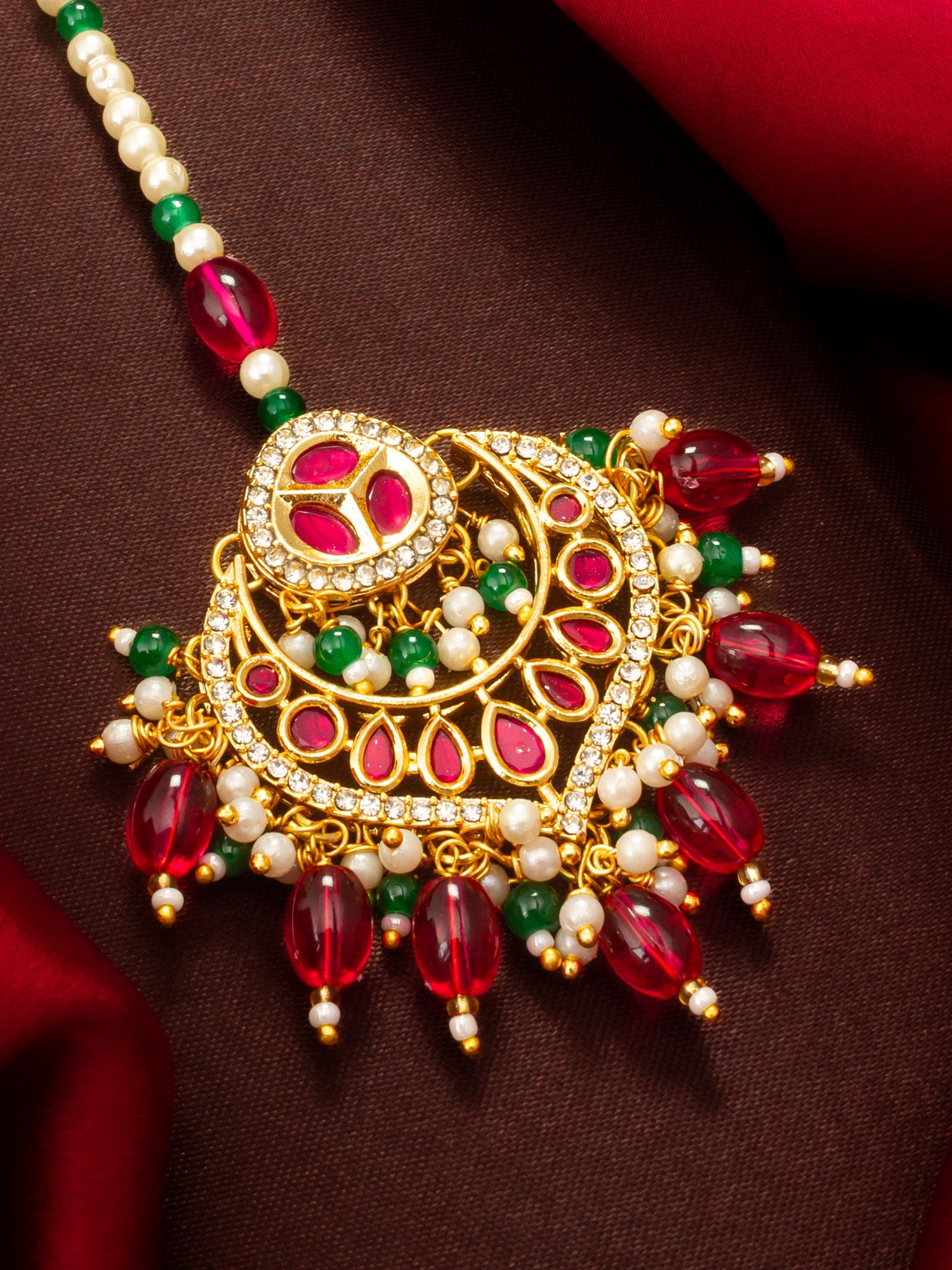Aadita Gold Plated Kundan Maang Tikka with Pink and Green Beads