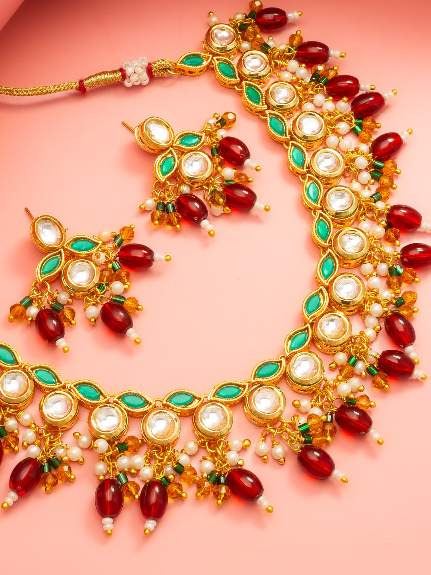Aadita Gold Plated Kundan Necklace Set with Green Meenakari, Red Beads and Crystal Accents with Earrings