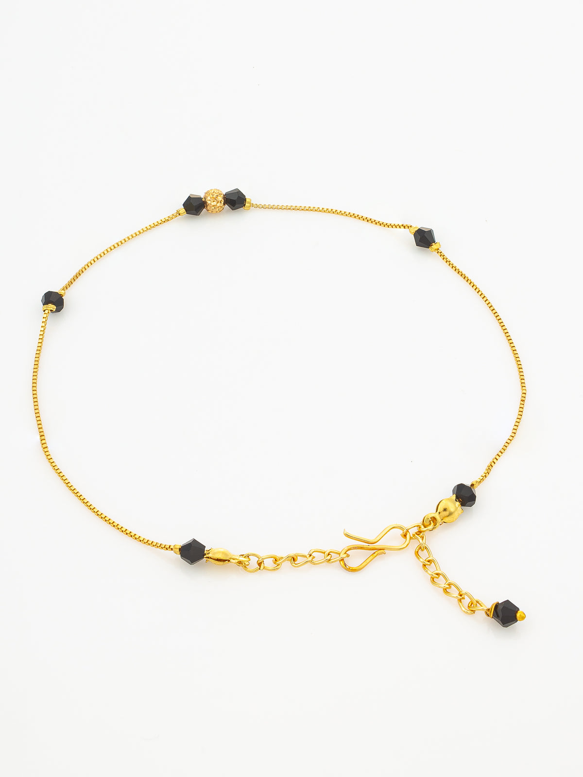 A delicate gold chain anklet with small black faceted beads and a toggle clasp, displayed on a clean white background.