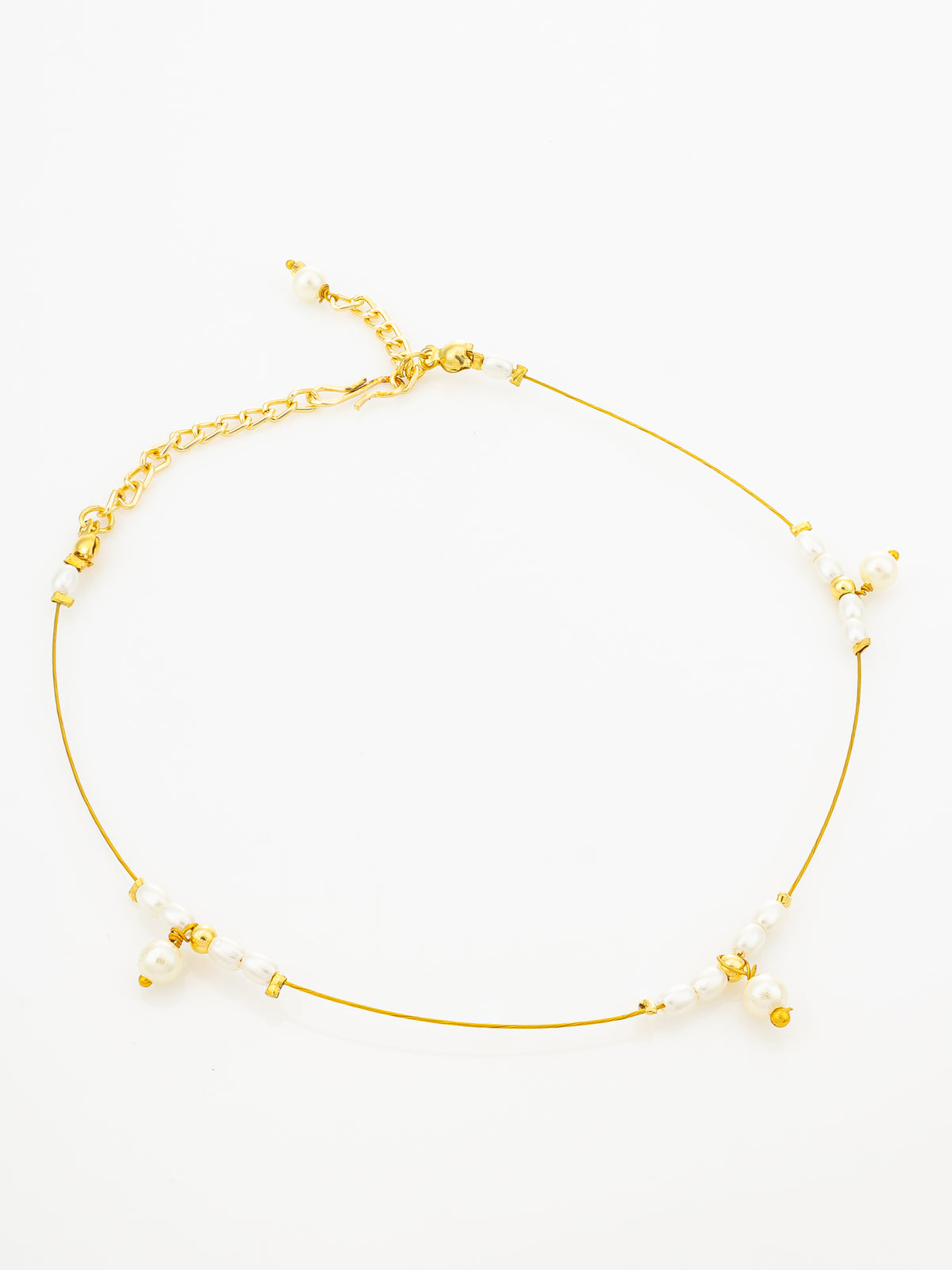 A delicate gold chain anklet with small white pearl-like beads and tiny gold spacer details, displayed on a clean white background.
