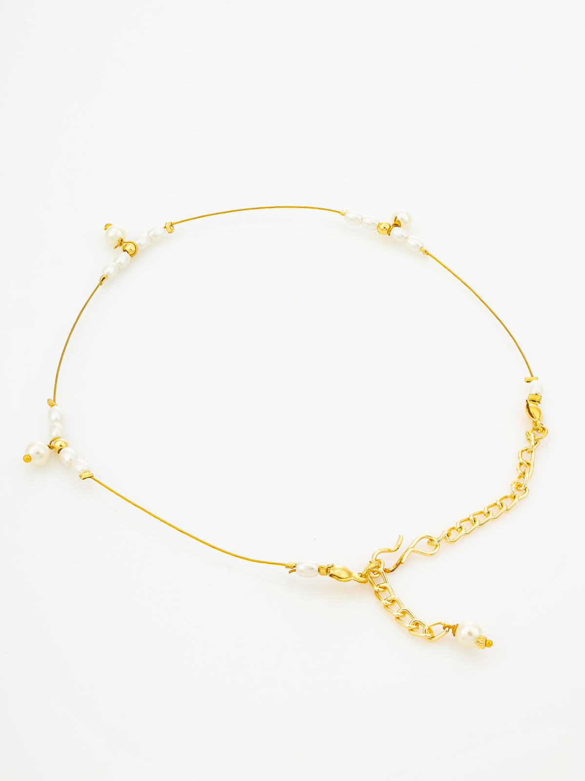 A delicate gold chain anklet with small white pearl beads and a short gold chain extender, displayed on a clean white background.