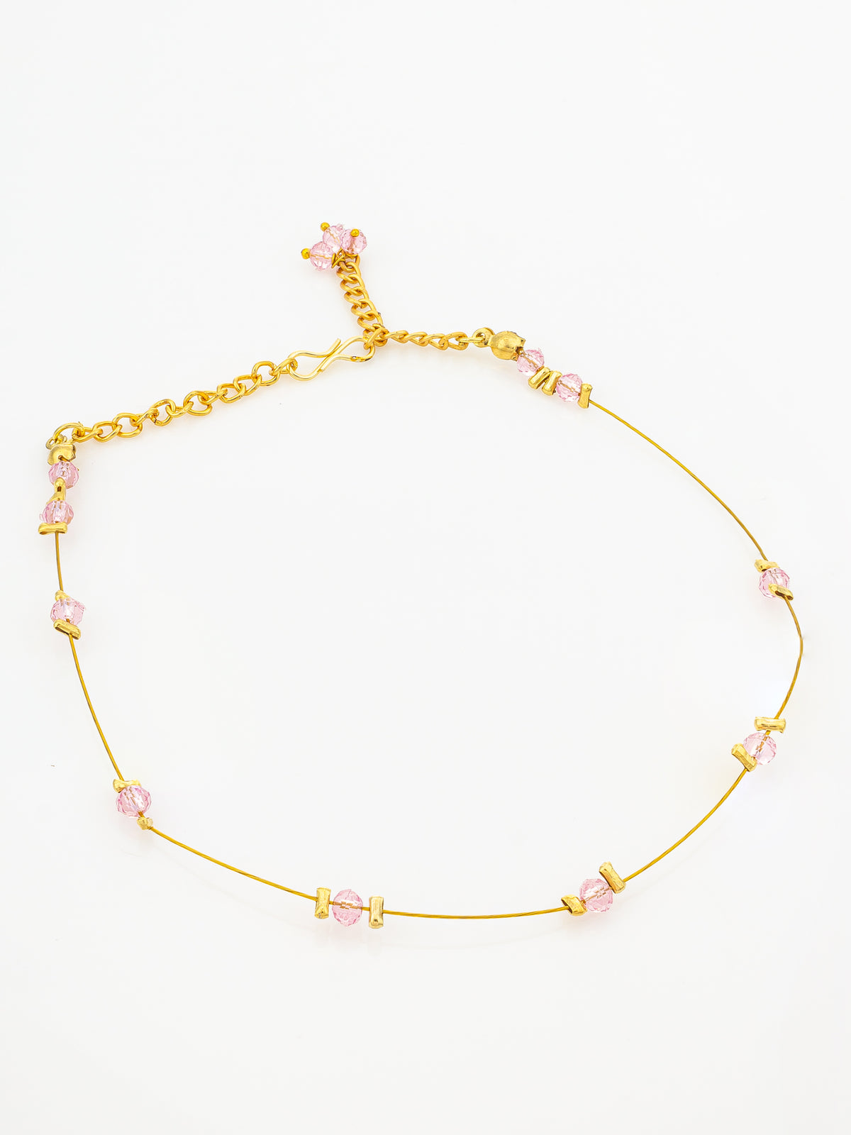 A delicate gold chain necklace with small pink faceted beads spaced along the thin chain, displayed on a clean white background.