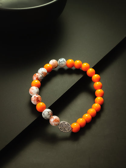 Aadita Orange and Marbled Beaded Bracelet with Engraved Silver Charm