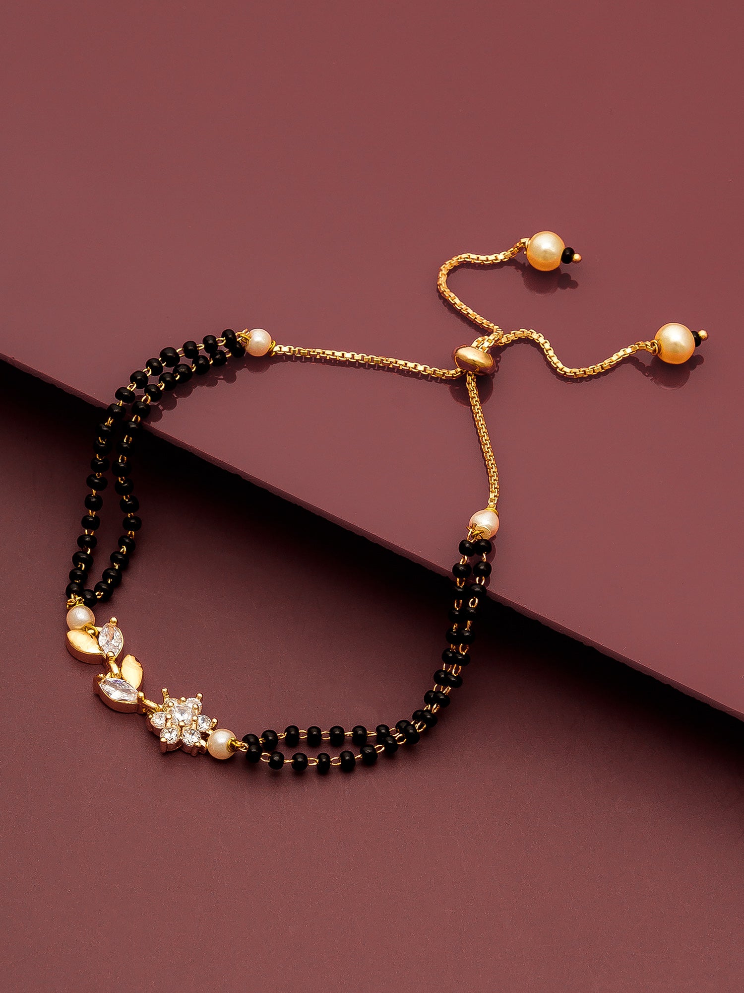Aadita Floral Motif Dual Layered Black Bead Gold Mangalsutra Bracelet