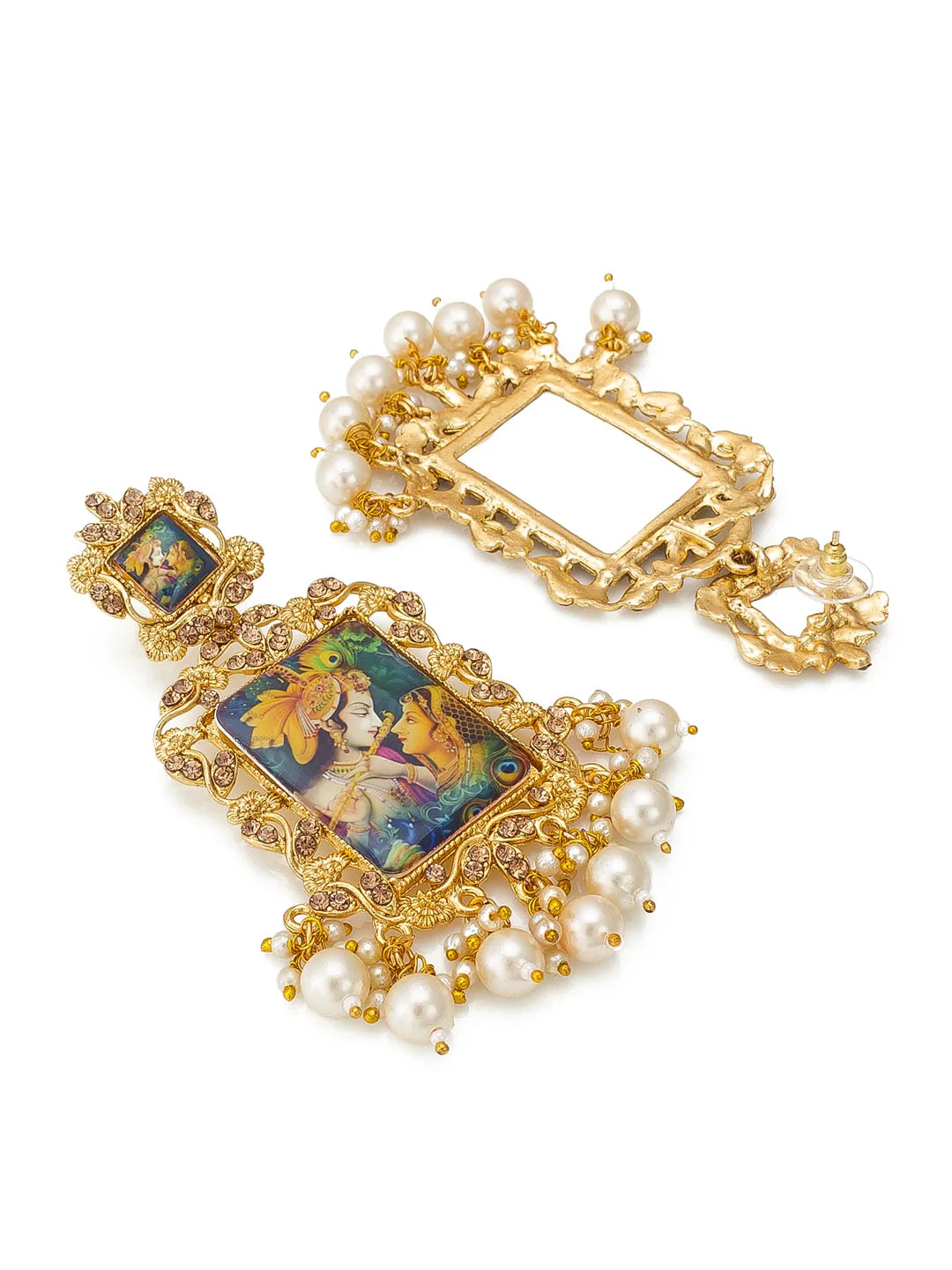 A pair of ornate gold-toned statement earrings with intricate filigree detailing, white faux pearls, and colorful enamel panels depicting figures and peacocks, shown on a plain white background.