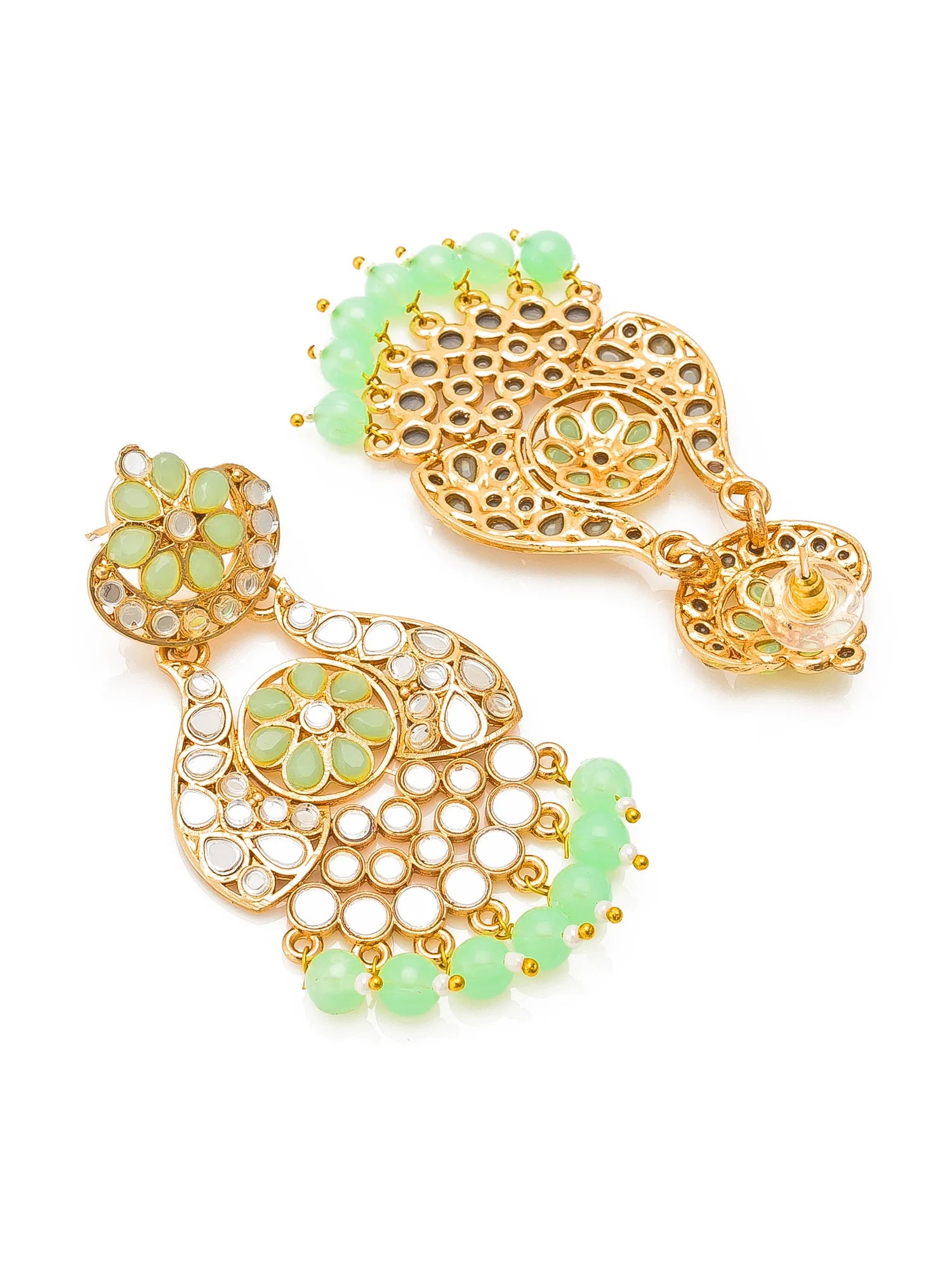 A pair of gold-plated dangle earrings decorated with light green beads, clear stone accents, and intricate filigree patterns, displayed on a clean white background.