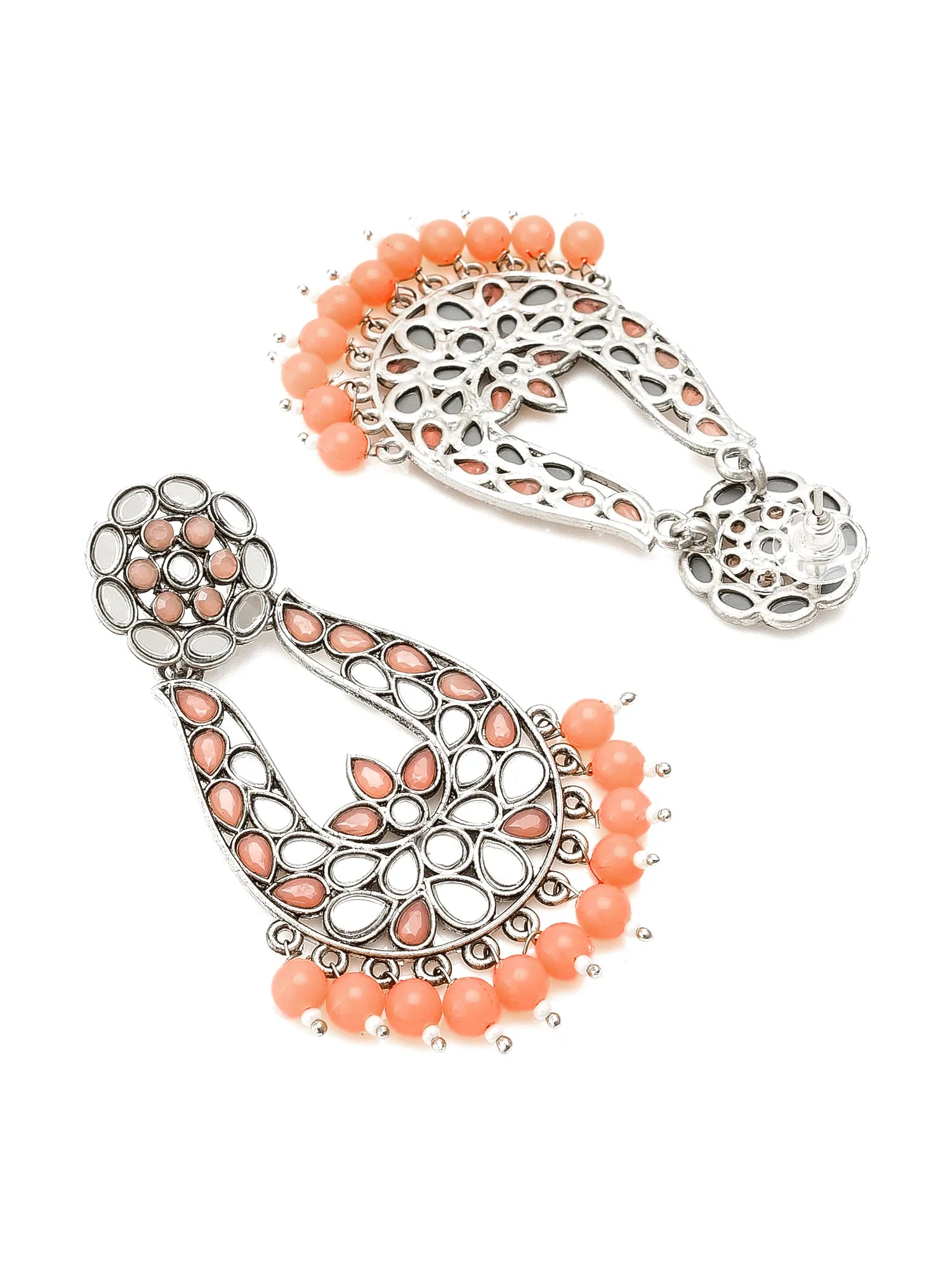Silver-toned filigree dangle earrings with peach-pink teardrop stones and coral-orange bead fringe, shown on a plain white background.