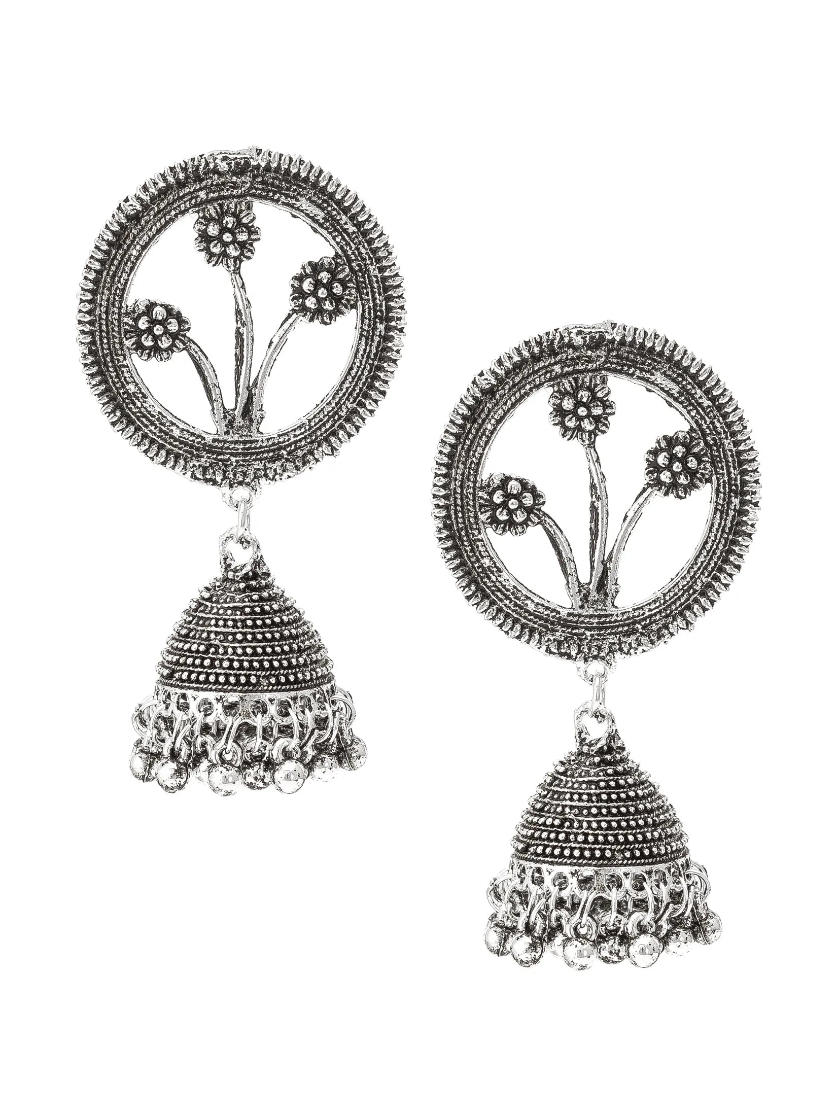 A pair of silver-toned Indian jhumka earrings with detailed filigree work, featuring a circular floral motif on the top and a textured bell-shaped dangle with hanging beads at the bottom, set against a plain white background.