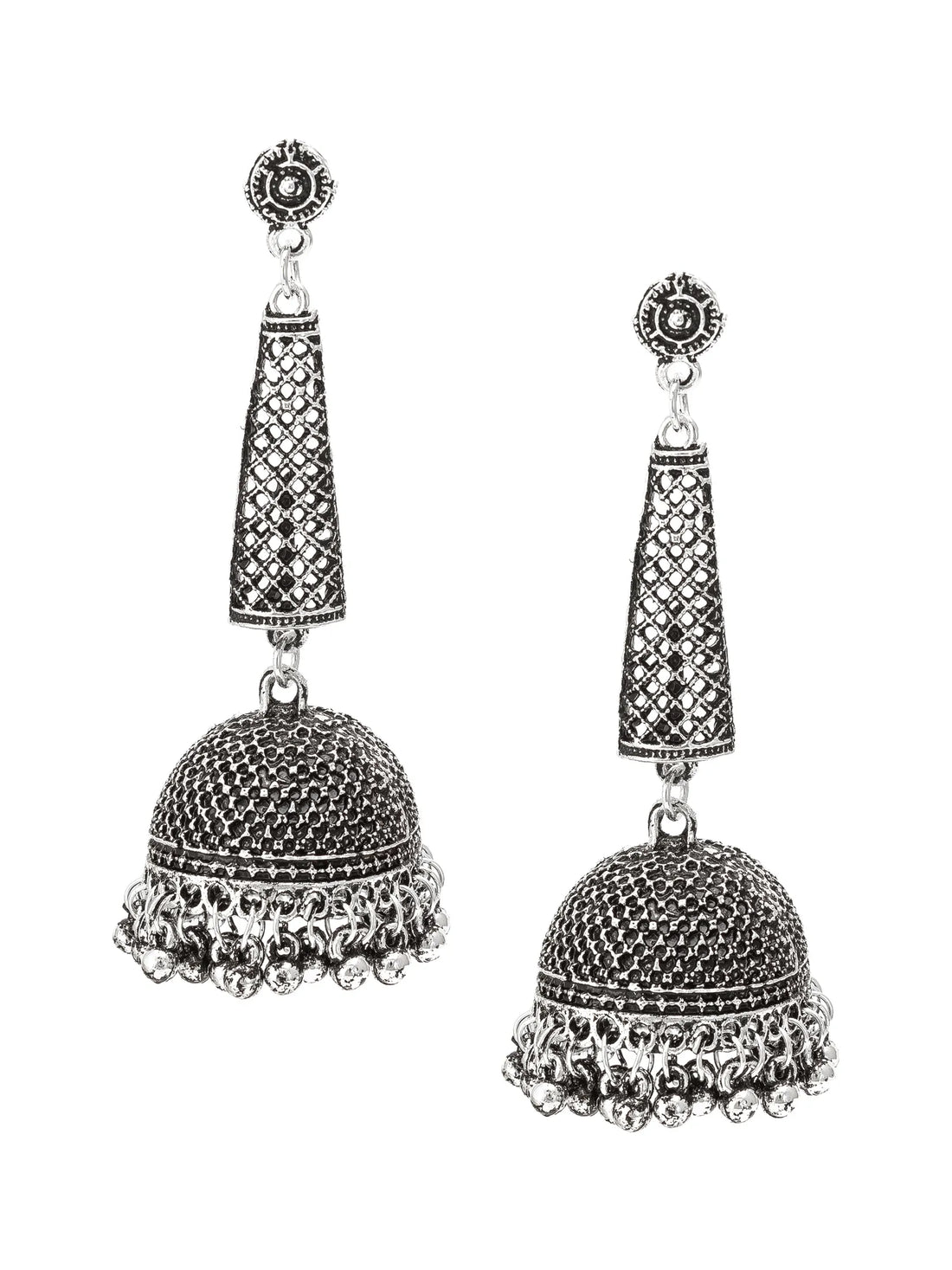 A pair of silver-toned Indian jhumka earrings with intricate filigree detailing, displayed on a wooden block and draped with dark green silk fabric.