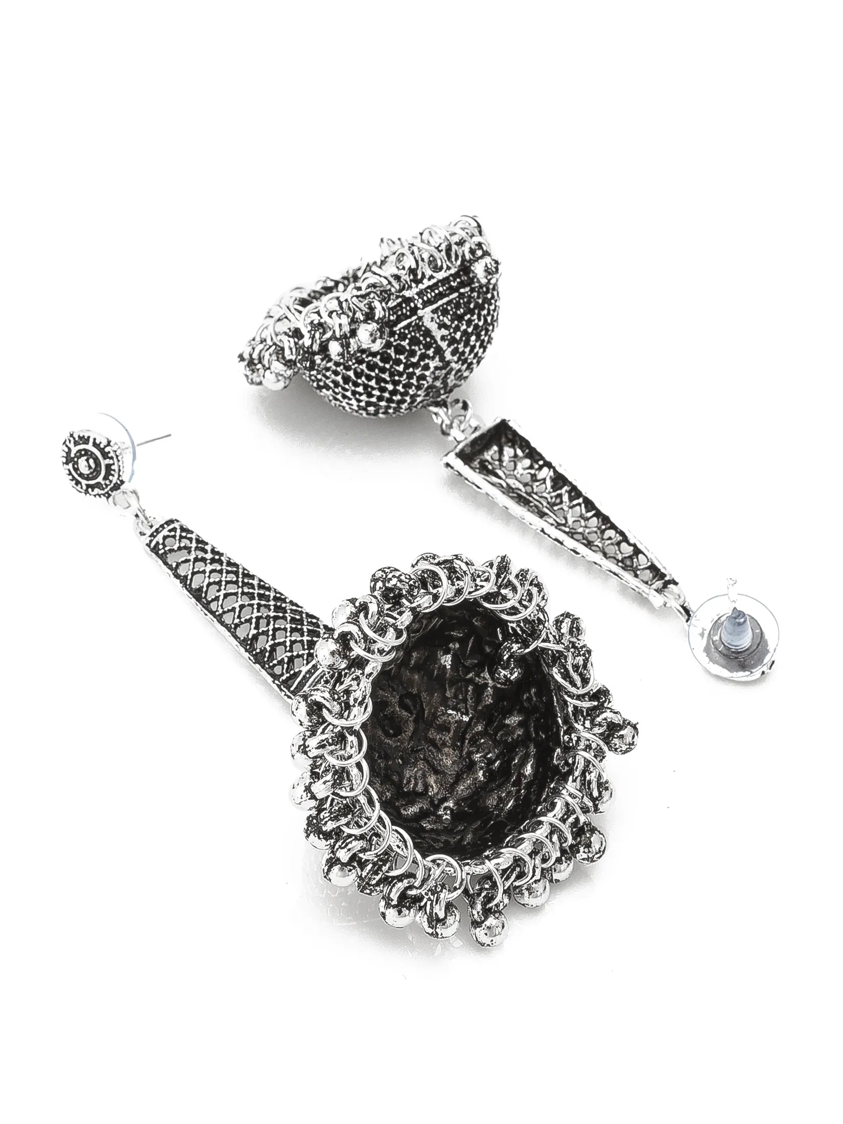 A pair of ornate silver-toned dangle earrings with textured woven details, a large oval dark center, and a small round clear stone at the end, shown on a plain white background.