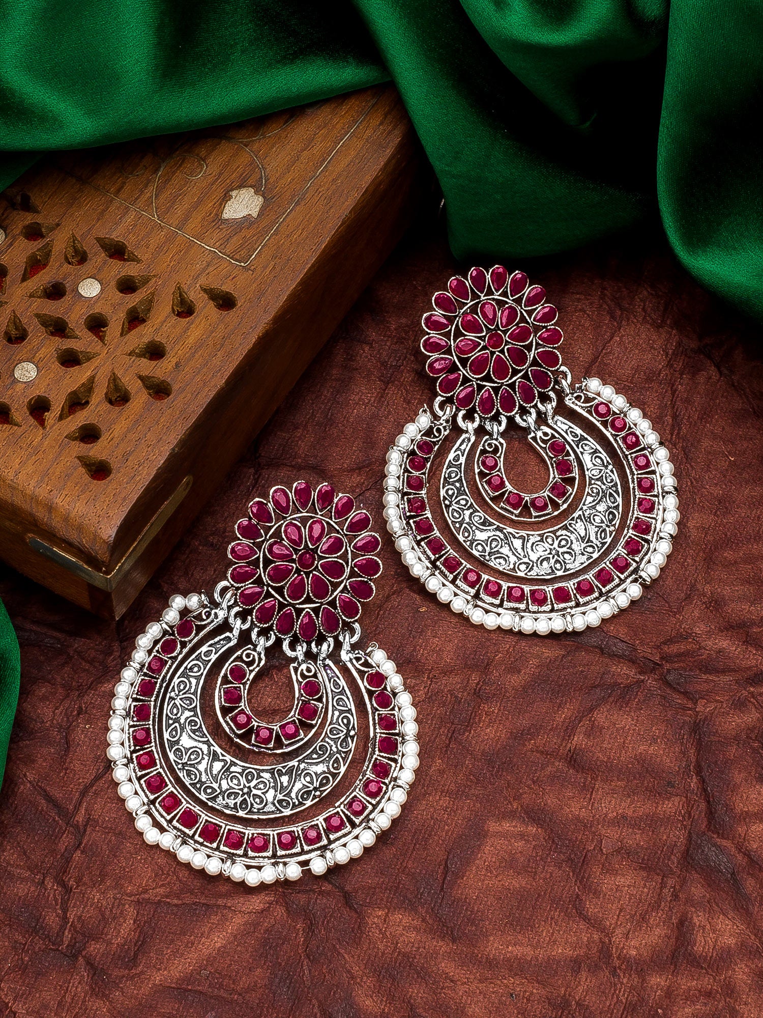 Aadita Festive Wear Red Stone Oxidized Chandelier Earrings with Pearl Border and Floral Stud Top