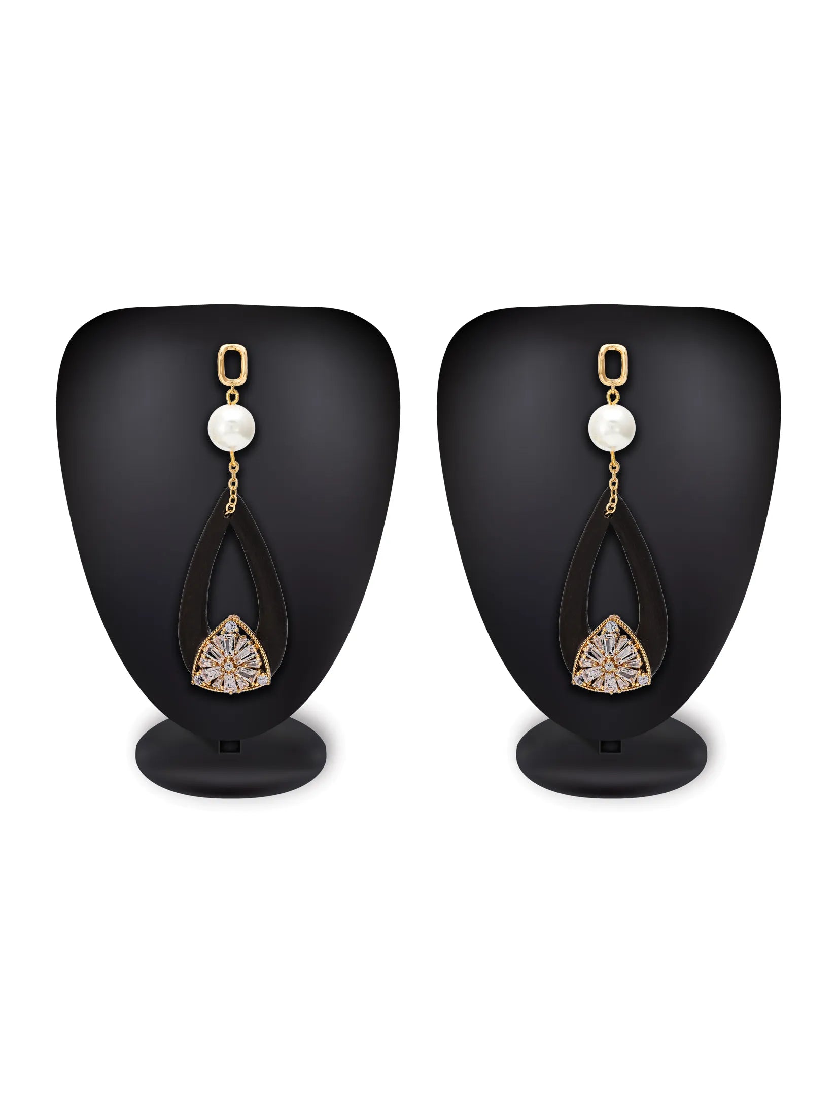A pair of gold and white drop earrings displayed on black mannequin busts against a white background. Each earring features a gold ring, a white pearl, a black teardrop-shaped drop, and a gold-toned triangular pendant with white stones.