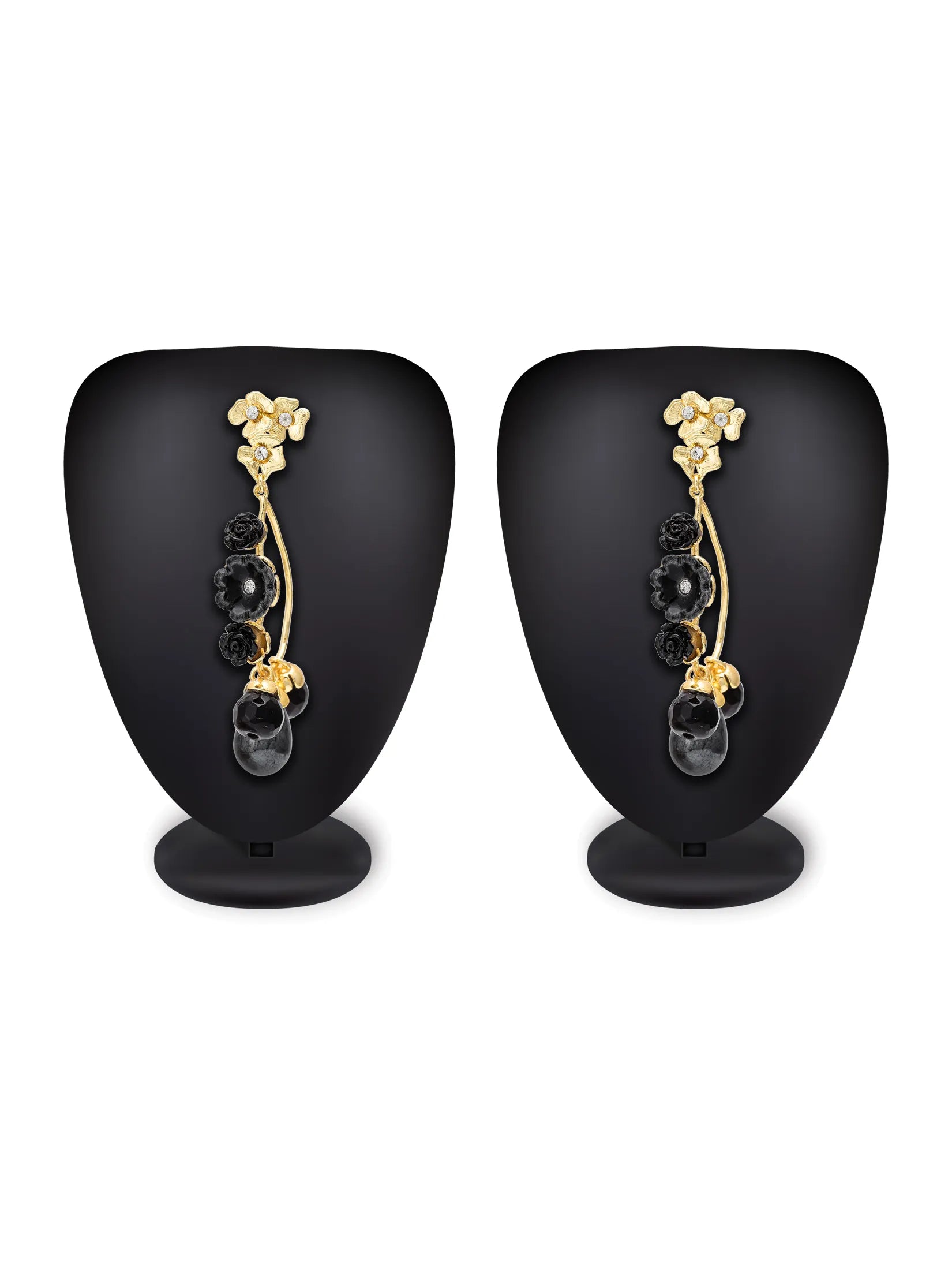 A pair of gold and black drop earrings displayed on black mannequin busts against a white background.