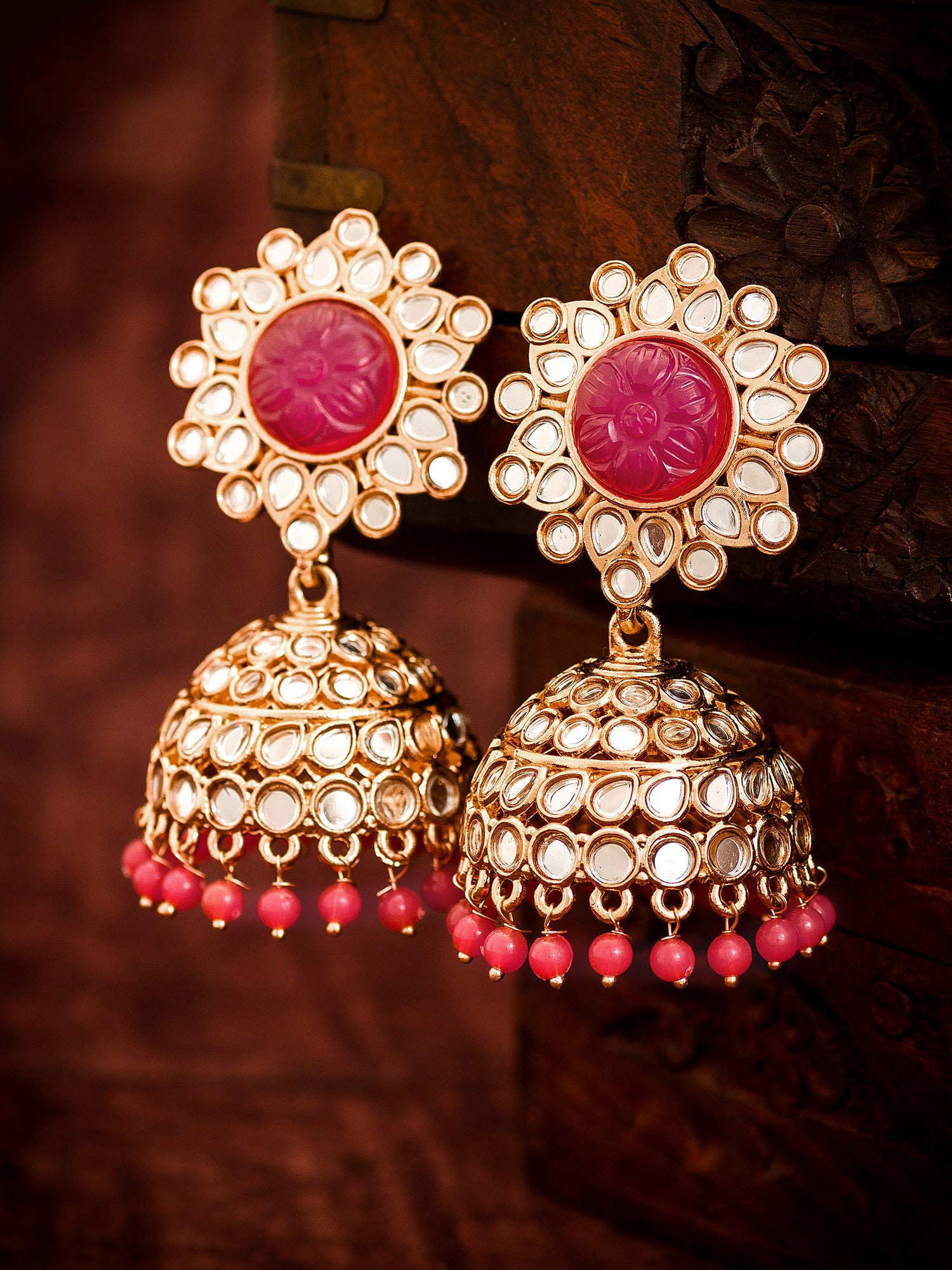 Aadita Wedding Wear Rose Gold-Tone Kundan Jhumka Earrings with Carved Pink Stone Top and Coral Bead Drops