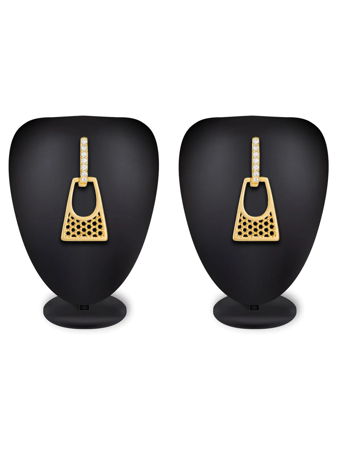 A pair of gold geometric drop earrings with clear crystal accents, displayed on a neutral gray surface with a yellow decorative element in the top right corner.