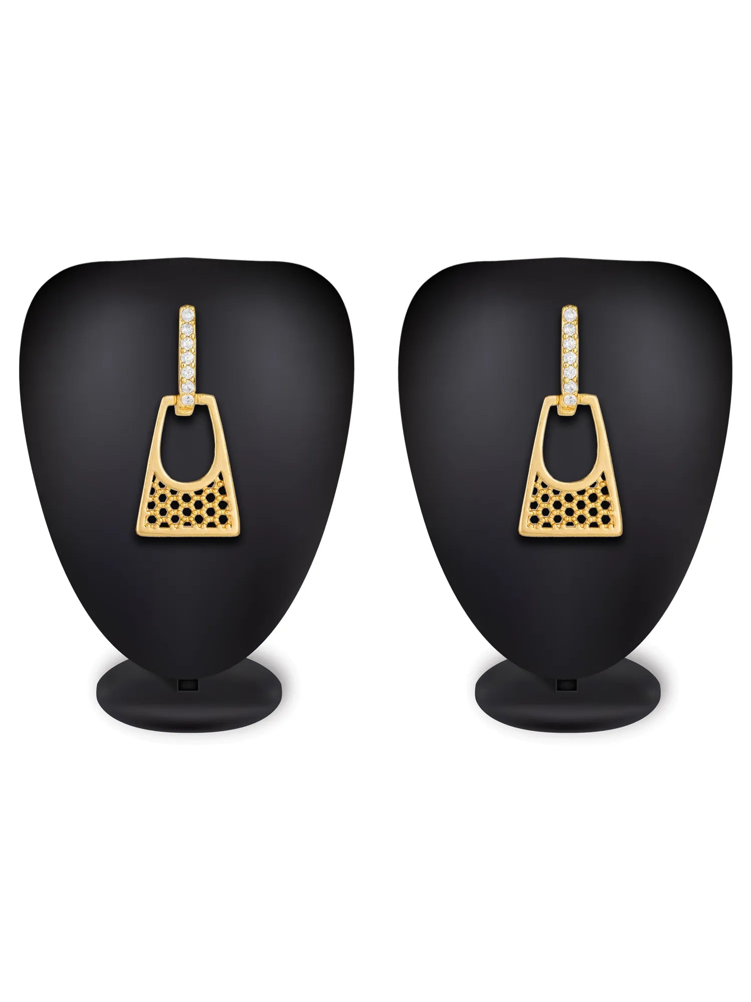 A pair of gold geometric dangle earrings displayed on black mannequin busts against a white background.