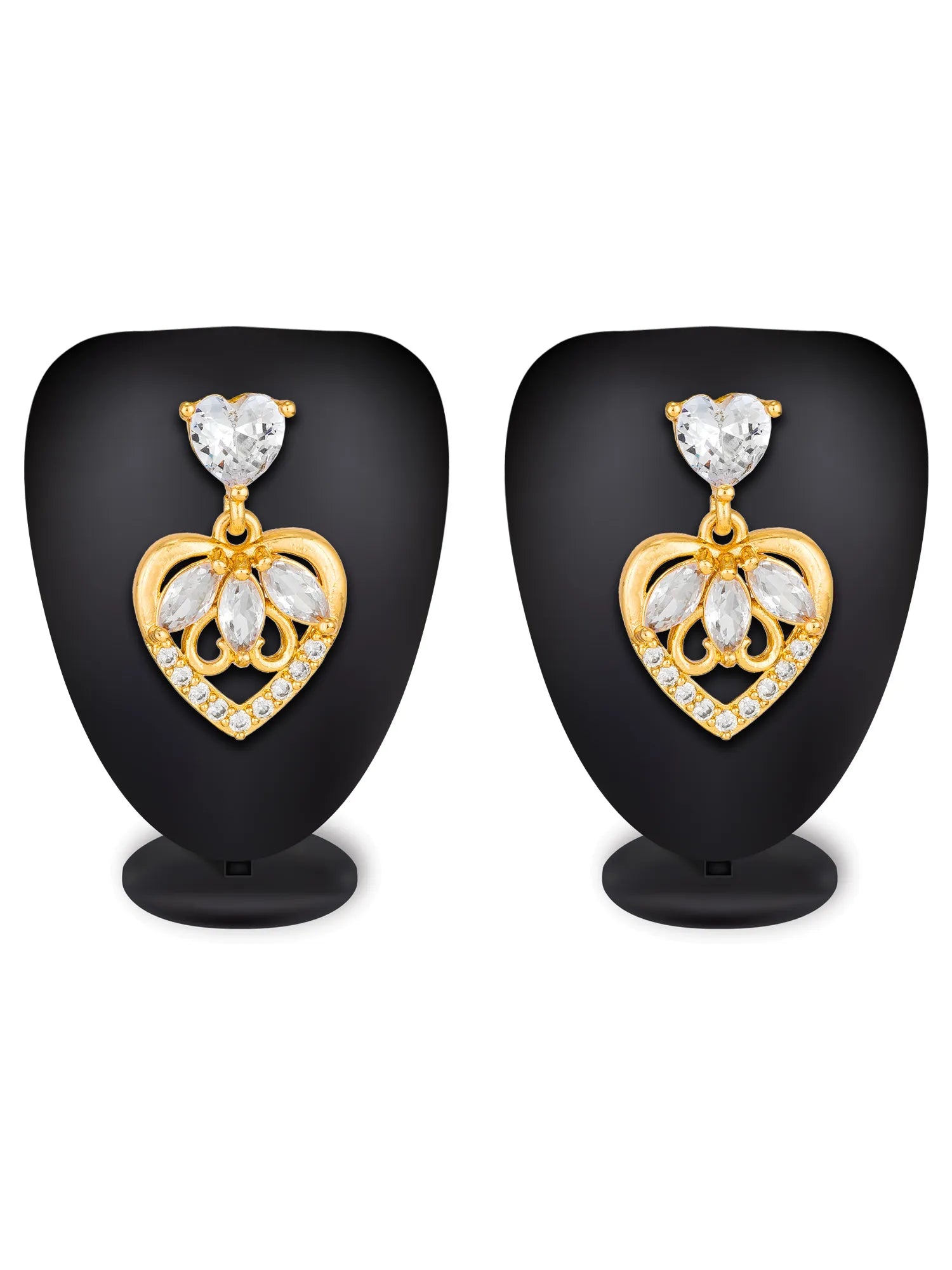 A pair of gold heart-shaped drop earrings with clear heart-shaped gemstones and small clear accent stones, displayed on black mannequin busts against a white background.
