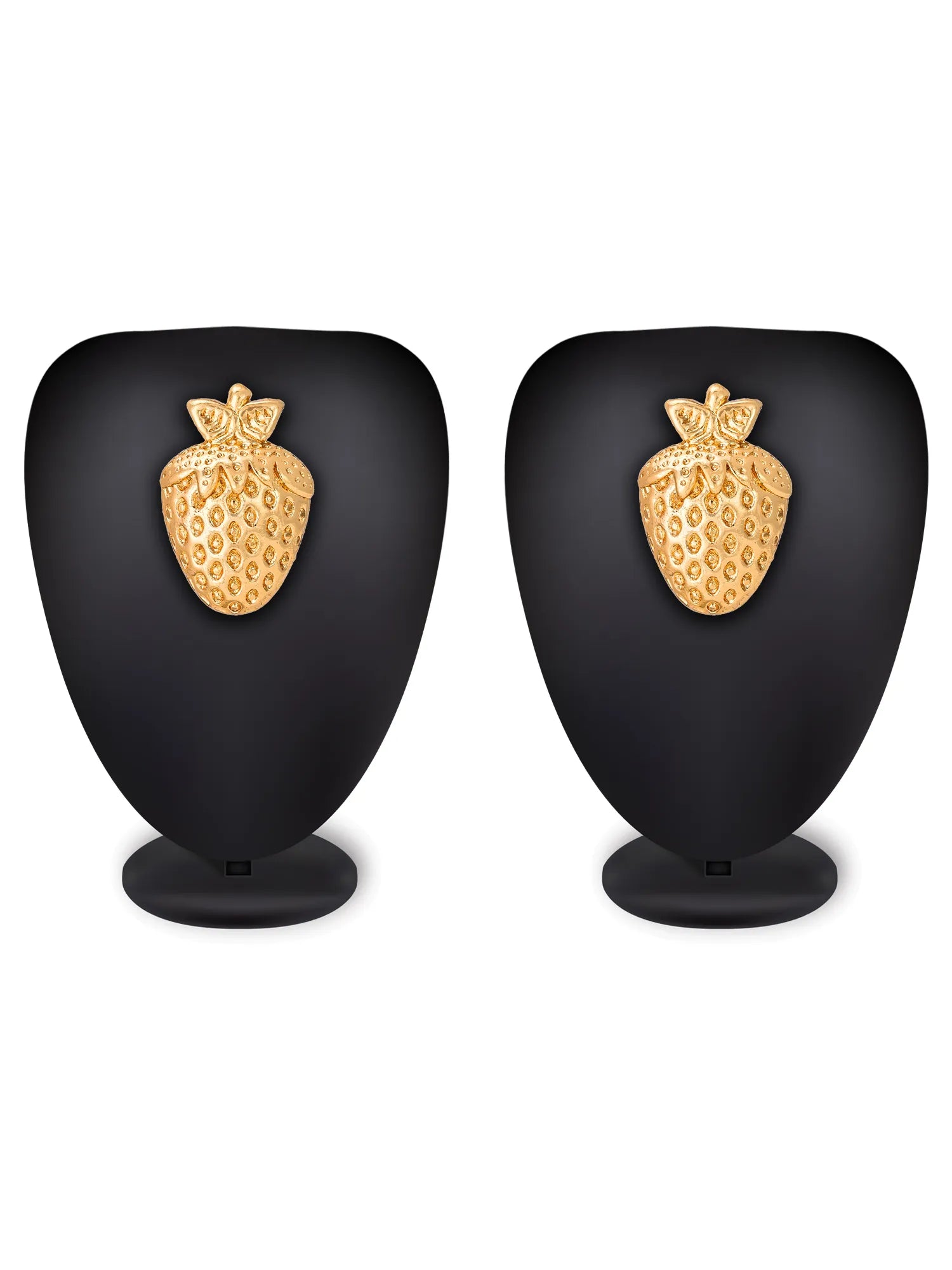 Pair of gold strawberry-shaped earrings on black stands against a white background