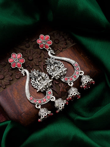 Oxidized Lakshmi Chandbali Earrings On A Green Background