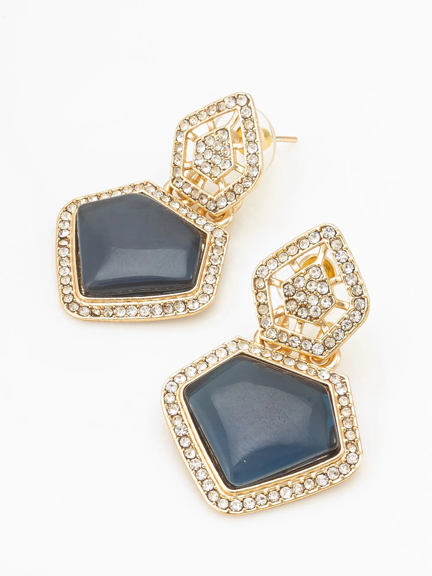Gold and blue earrings on a white background