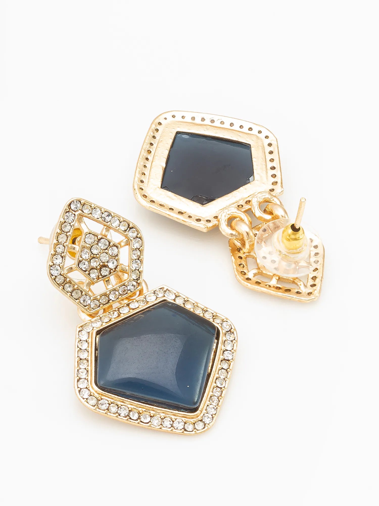 Gold-tone geometric drop earrings with dark blue faceted stones and clear rhinestone borders, shown on a white background.