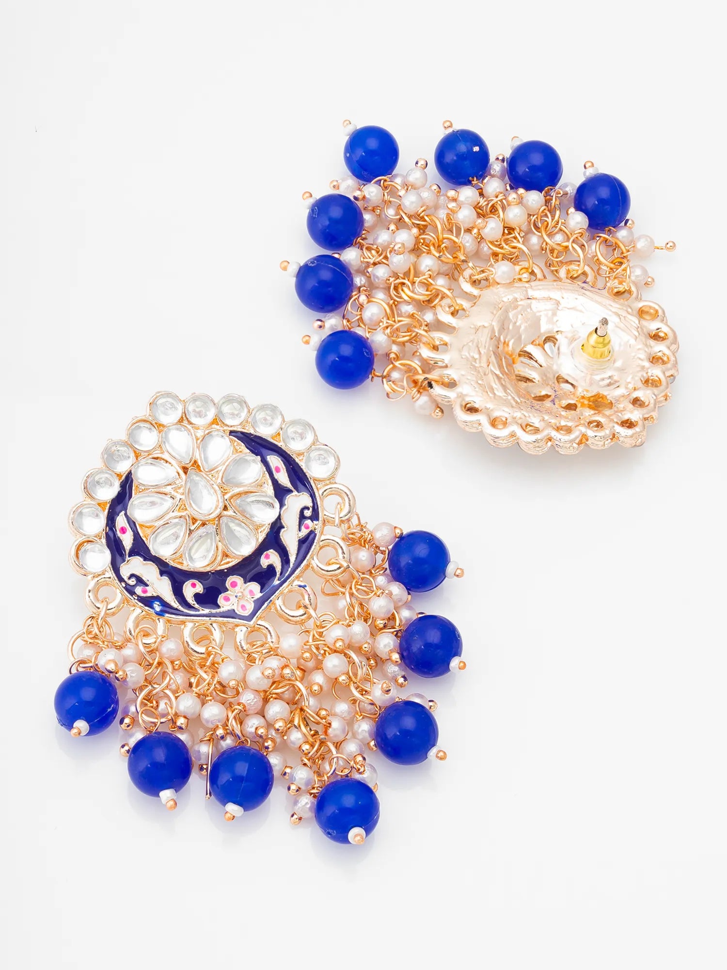 Pair of earrings with blue beads and gold accents on a white background