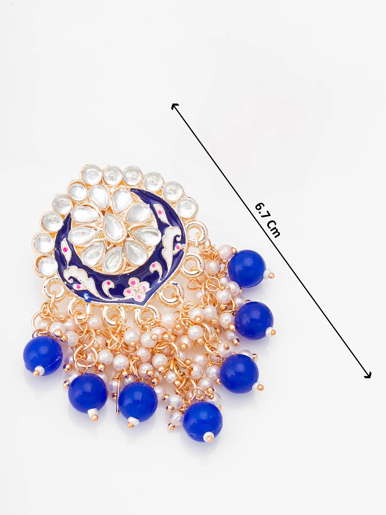 Decorative brooch with blue and gold elements on a white background