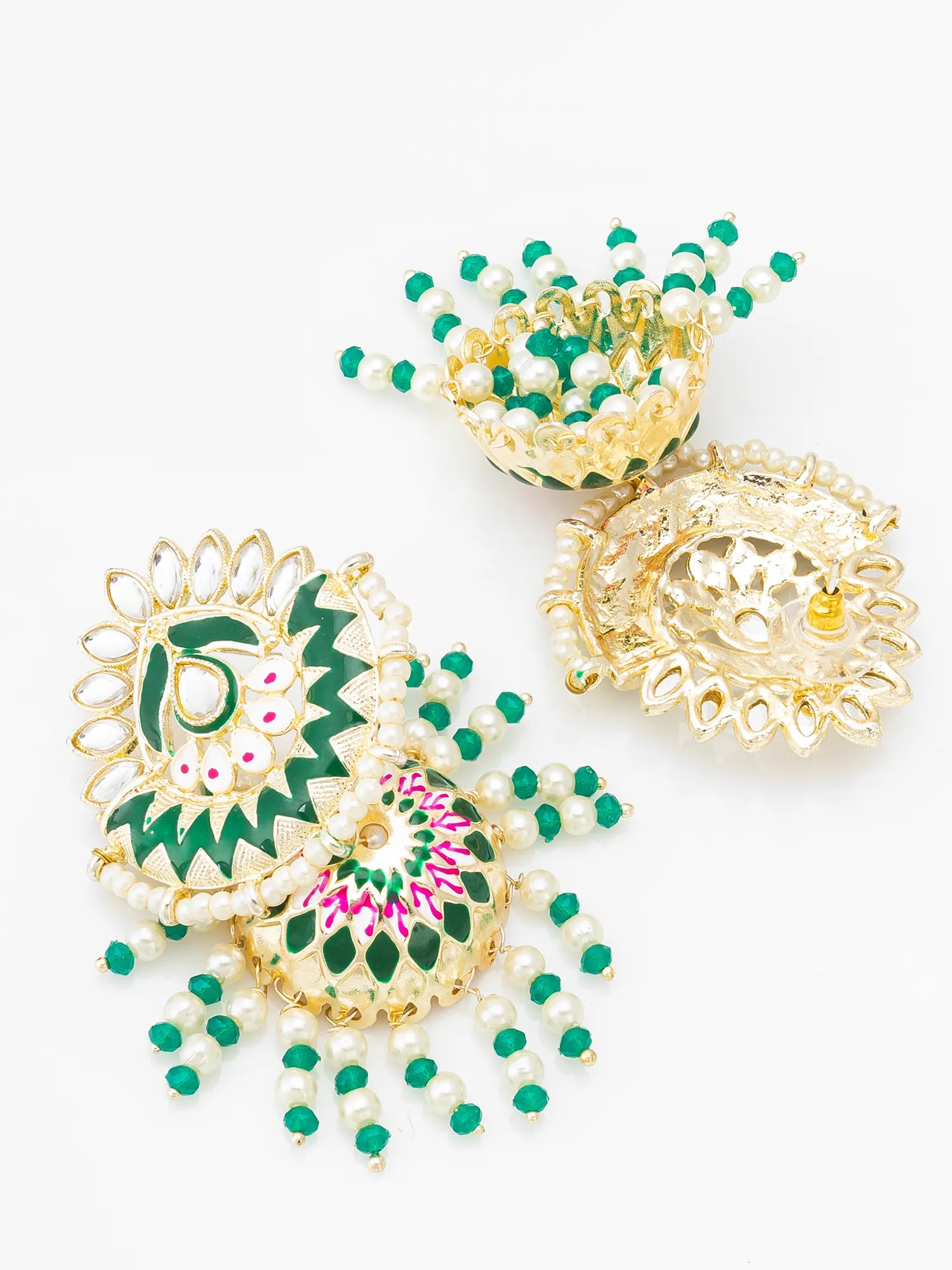 Decorative gold and green items on a white background