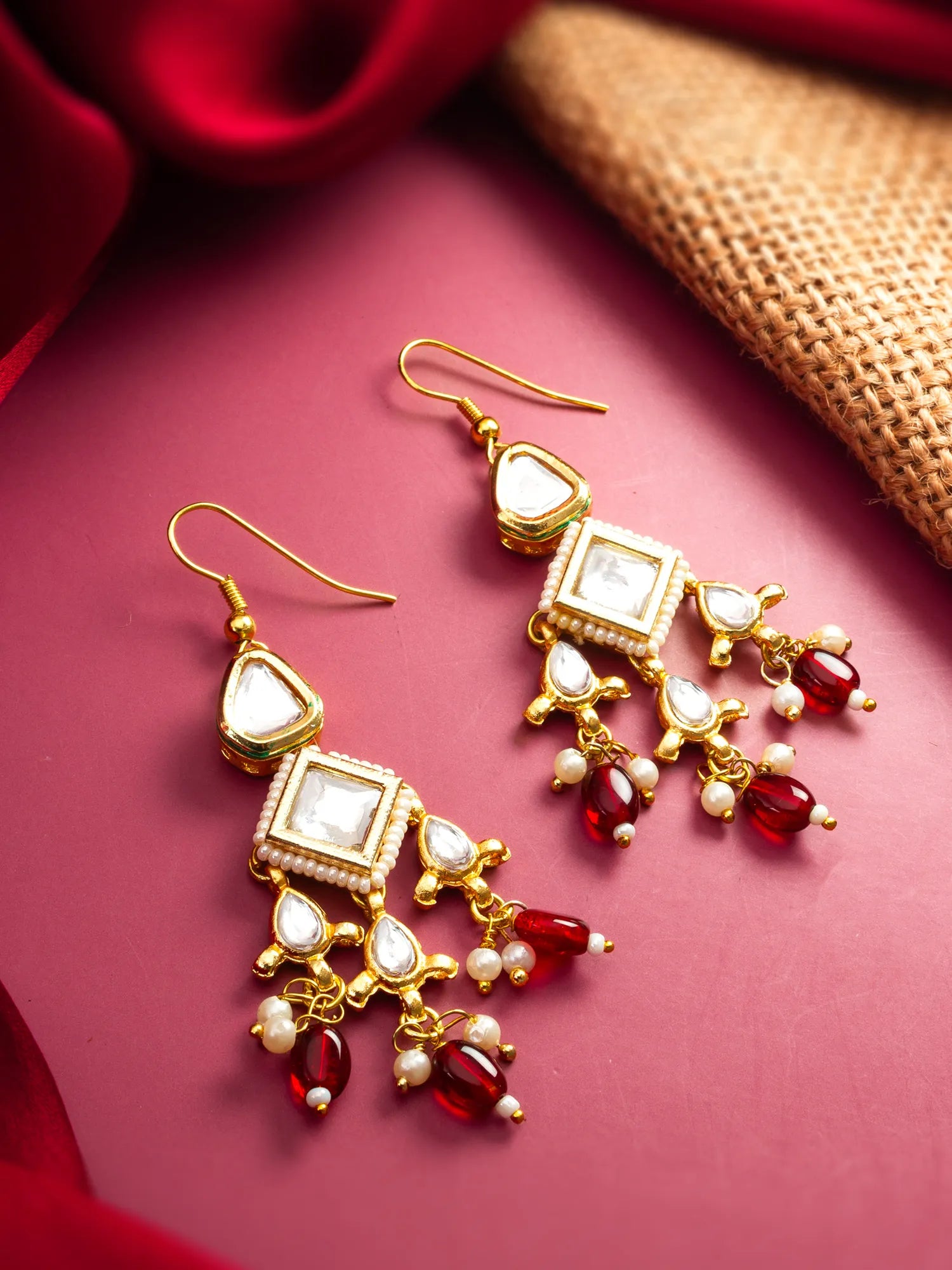 Gold Toned Kundan Chandelier Earrings with Red Bead Drops