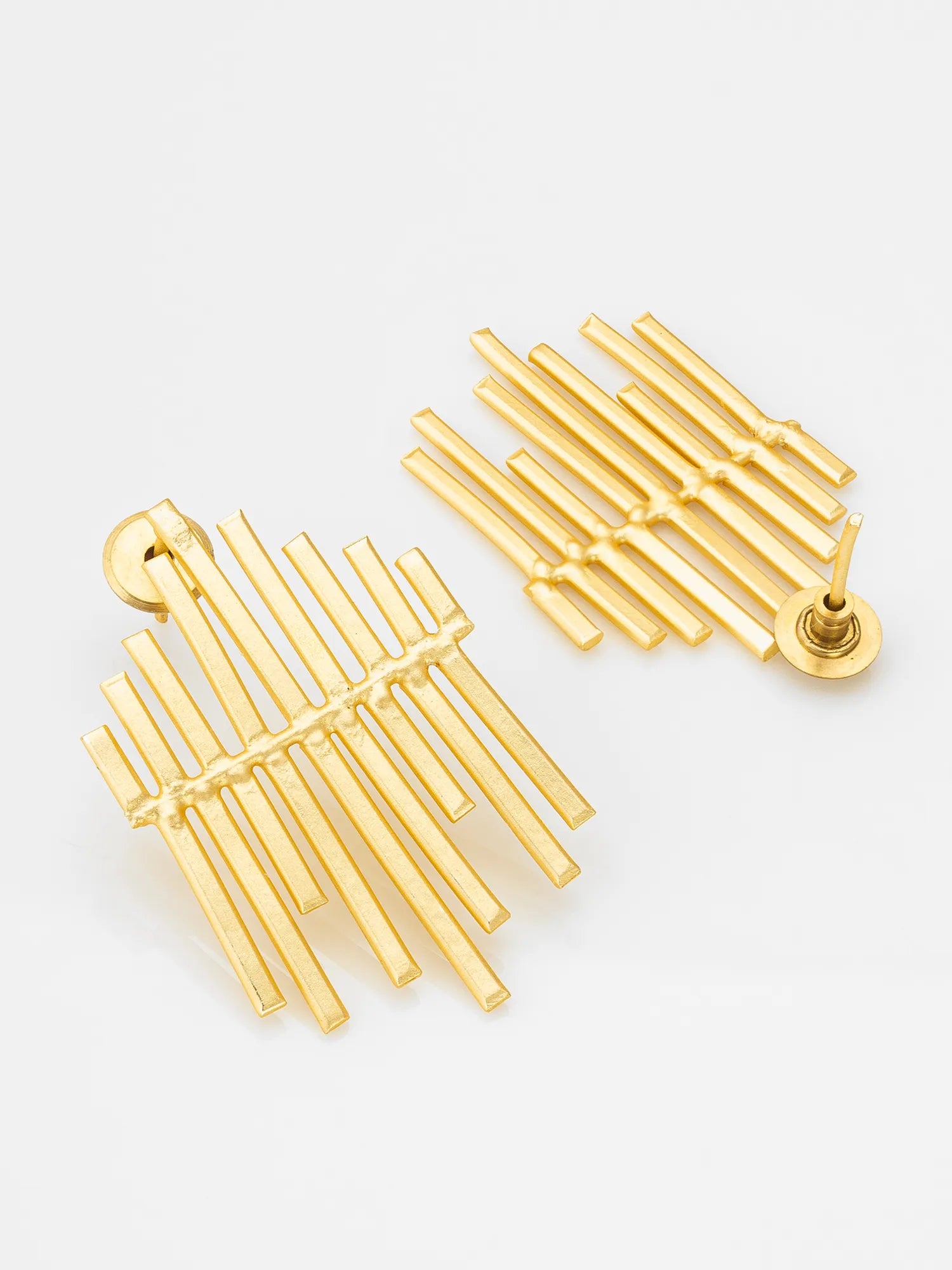 A pair of gold geometric dangle earrings with multiple parallel bar elements, displayed on a clean white background.