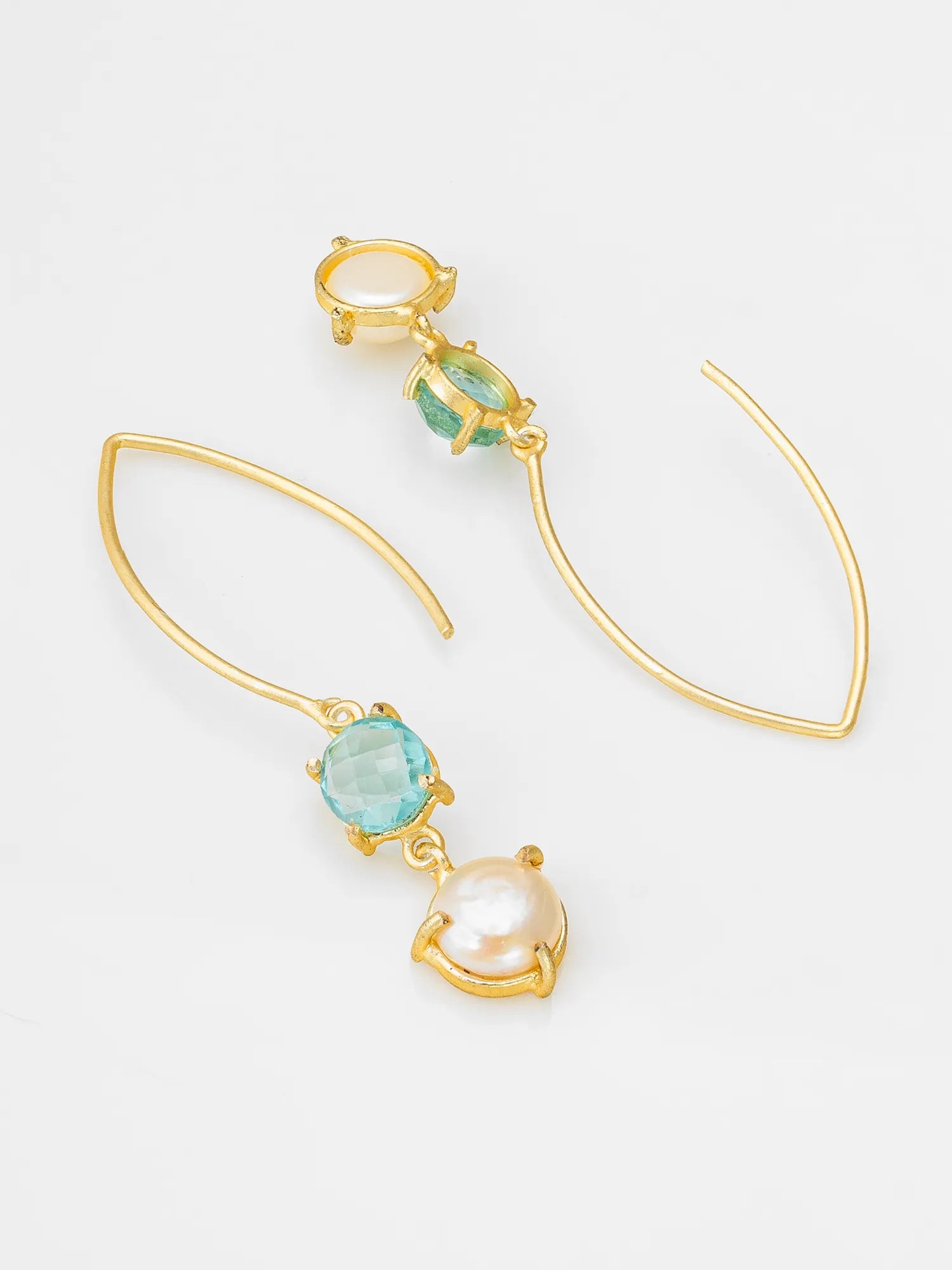 Gold-tone drop earrings featuring a light blue oval gemstone, a white pearl, and a small green marquise-cut gemstone, displayed on a clean white background.