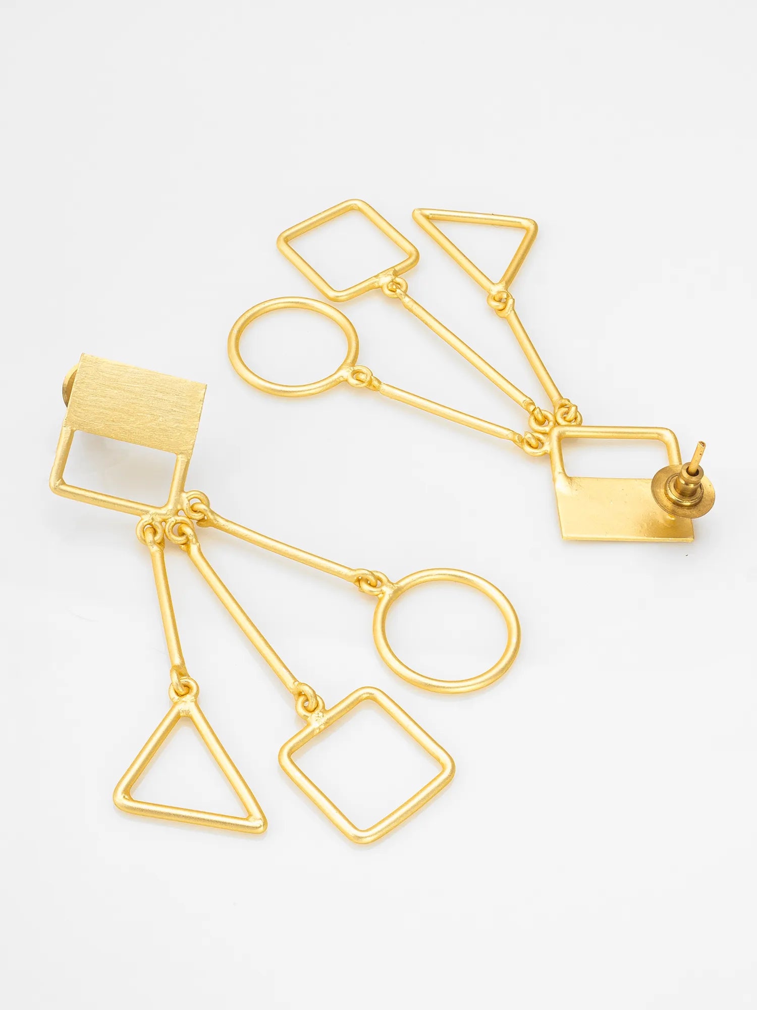 Gold geometric dangle earrings with open square, triangle, and oval shapes, displayed on a clean white background.