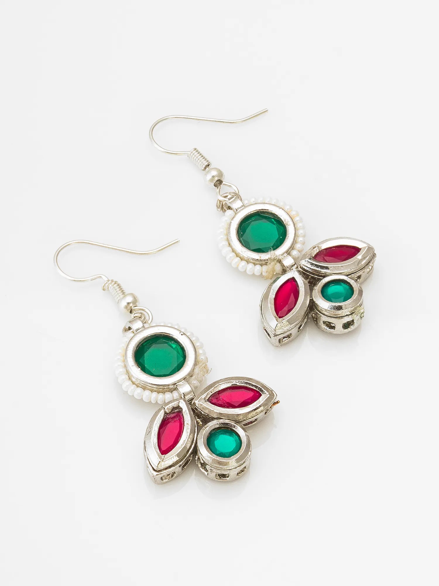 A pair of silver-toned dangle earrings with green and pink gemstone accents, displayed on a clean white background.