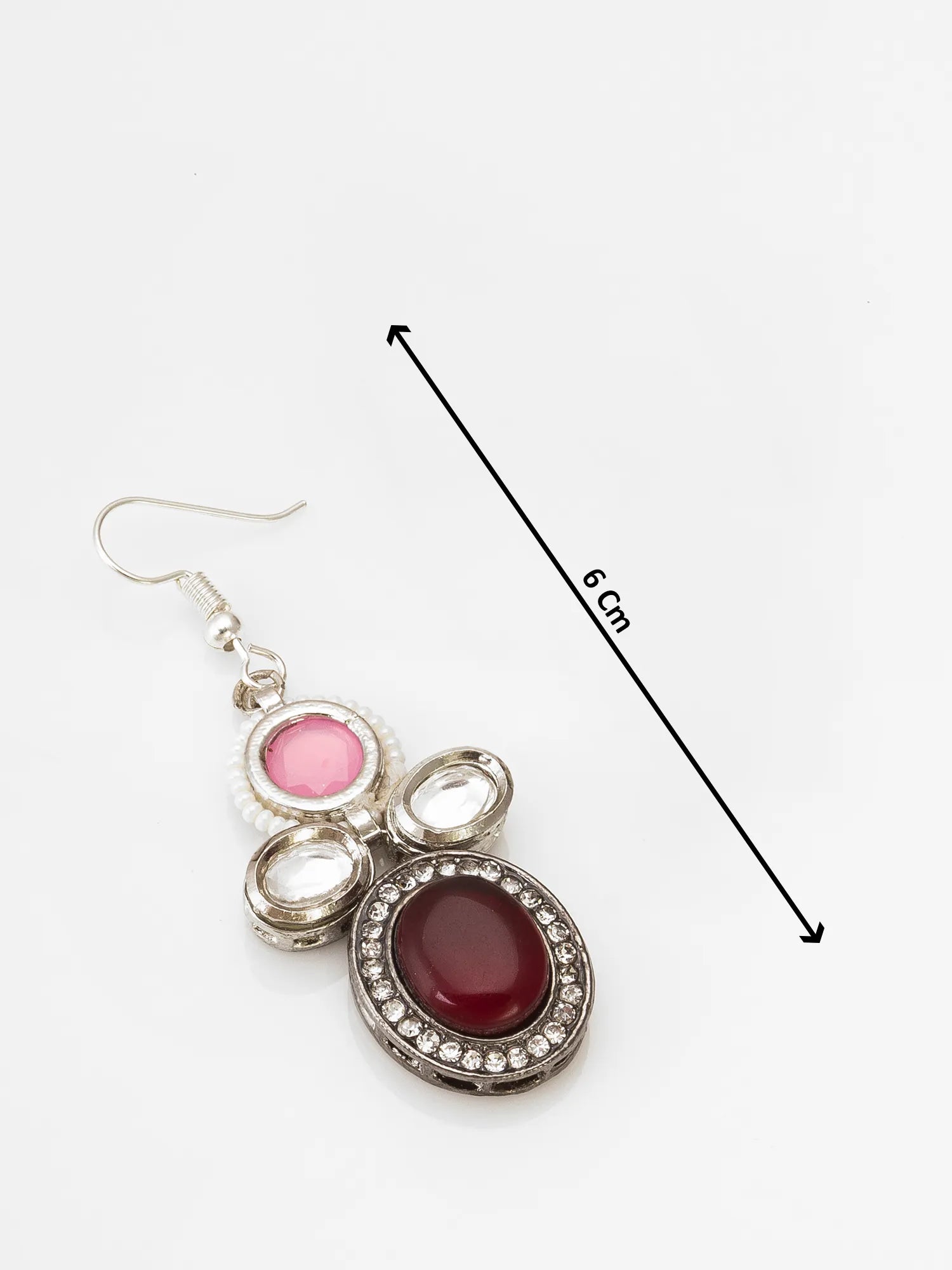 A silver-toned dangle earring with a pink oval stone, clear rhinestone accents, and a large dark red oval stone, shown on a white background with a black measurement arrow indicating 6 cm length.