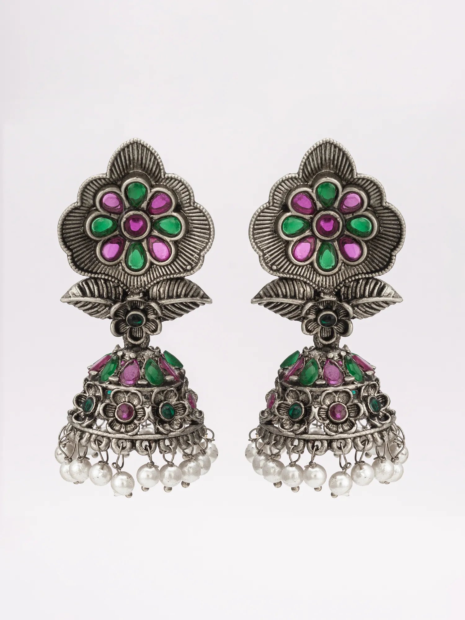 Oxidized jhumka earrings on a white background