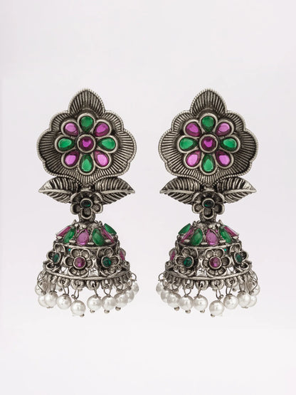 Oxidized jhumka earrings on a white background