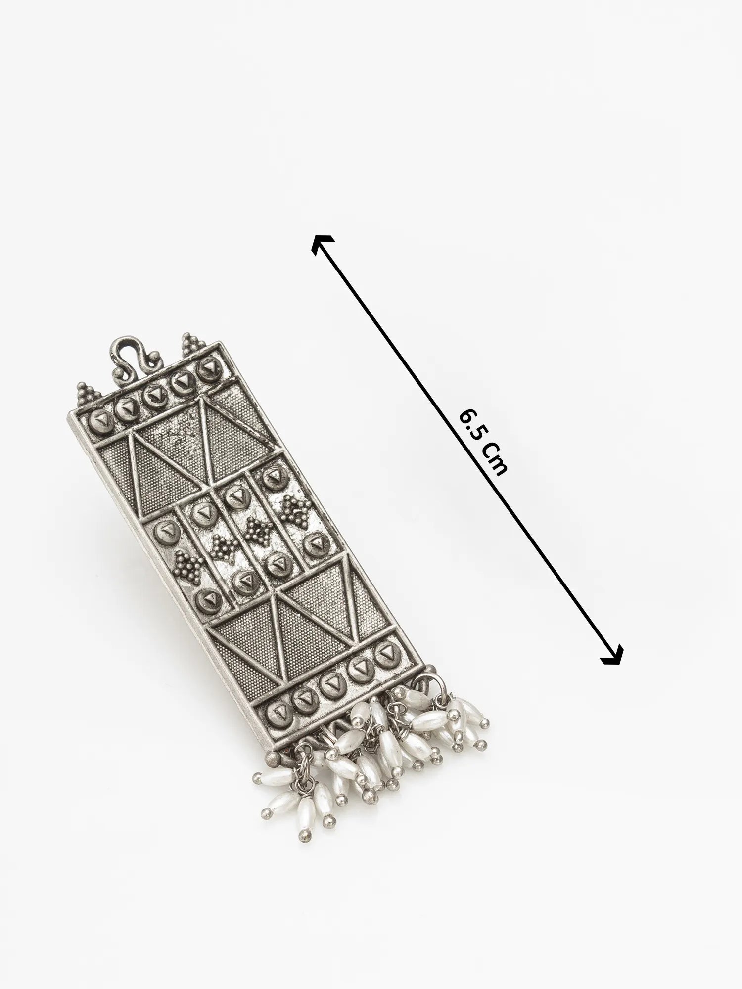 An ornate silver-toned rectangular pendant with geometric engraved patterns and dangling bead fringe, shown on a white background with a black dimension arrow labeled 6.5 cm.