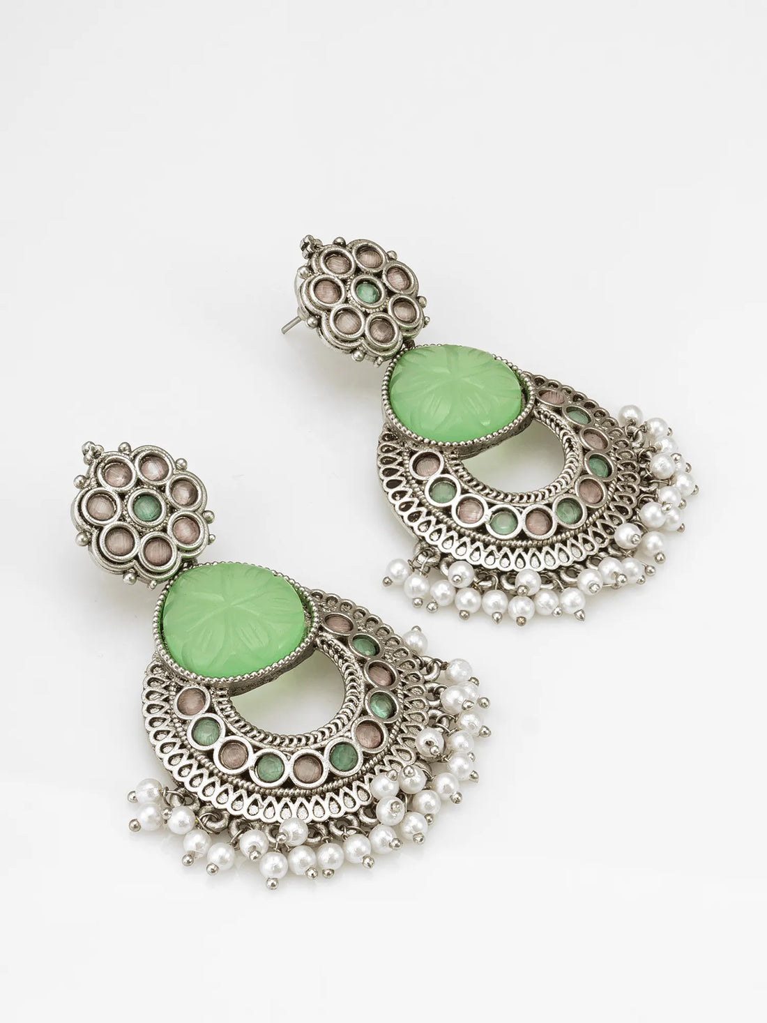 Oxidized Chandbali Earrings On A Green Background