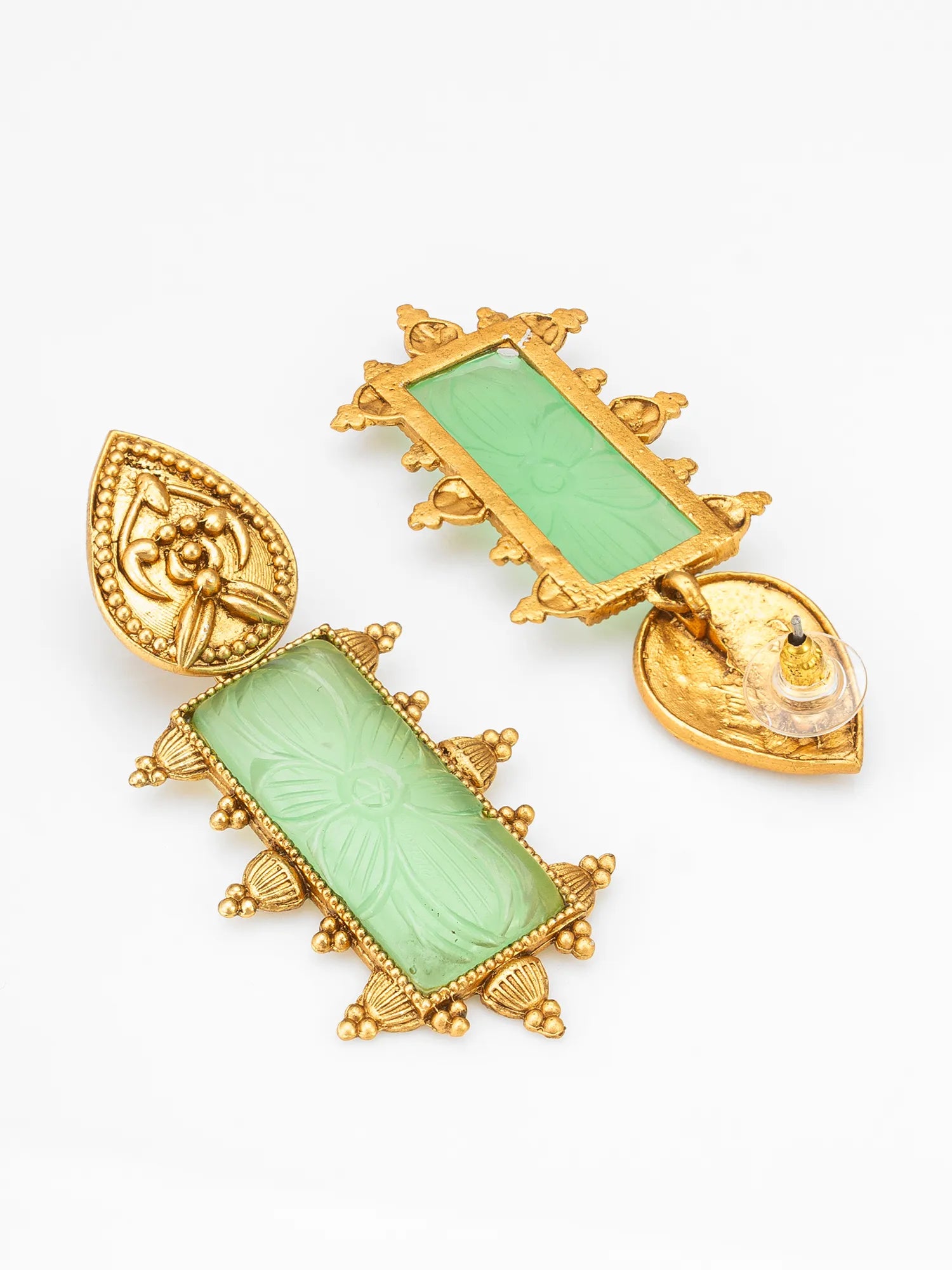 A pair of vintage gold-tone drop earrings with rectangular light green carved stone inlays and decorative gold-tone filigree borders, shown on a plain white background.