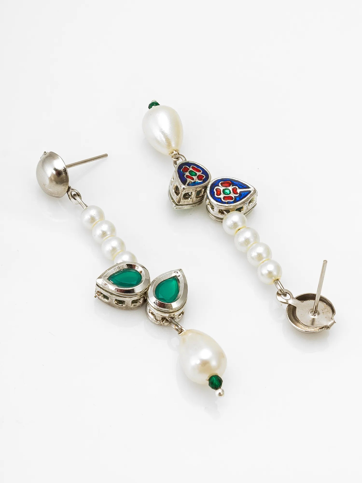 A pair of silver-toned dangle earrings with white pearl beads, green teardrop gemstones, and a colorful enamel heart charm, shown on a plain white background.