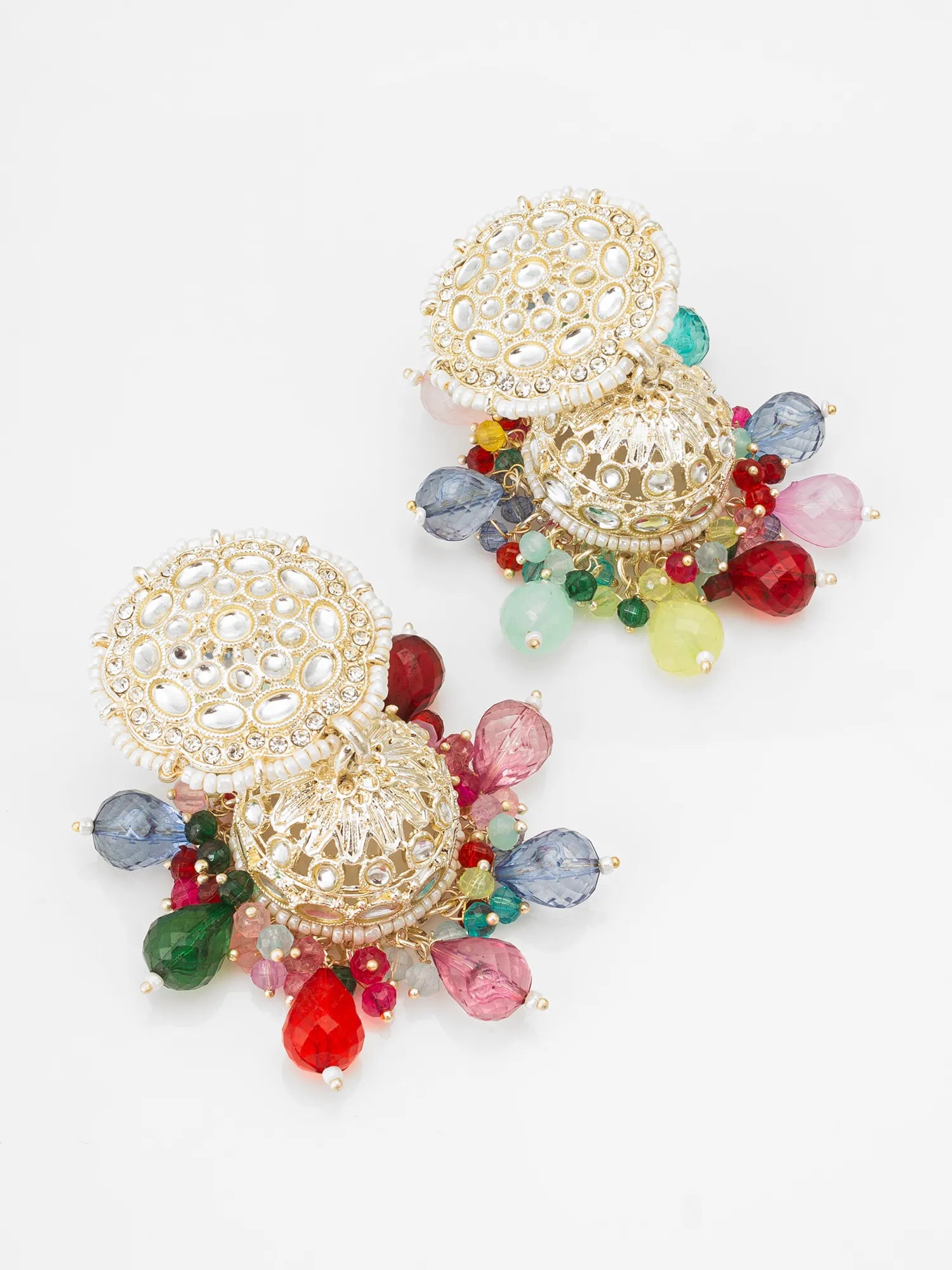 Colorful earrings with gold filigree design on a white background