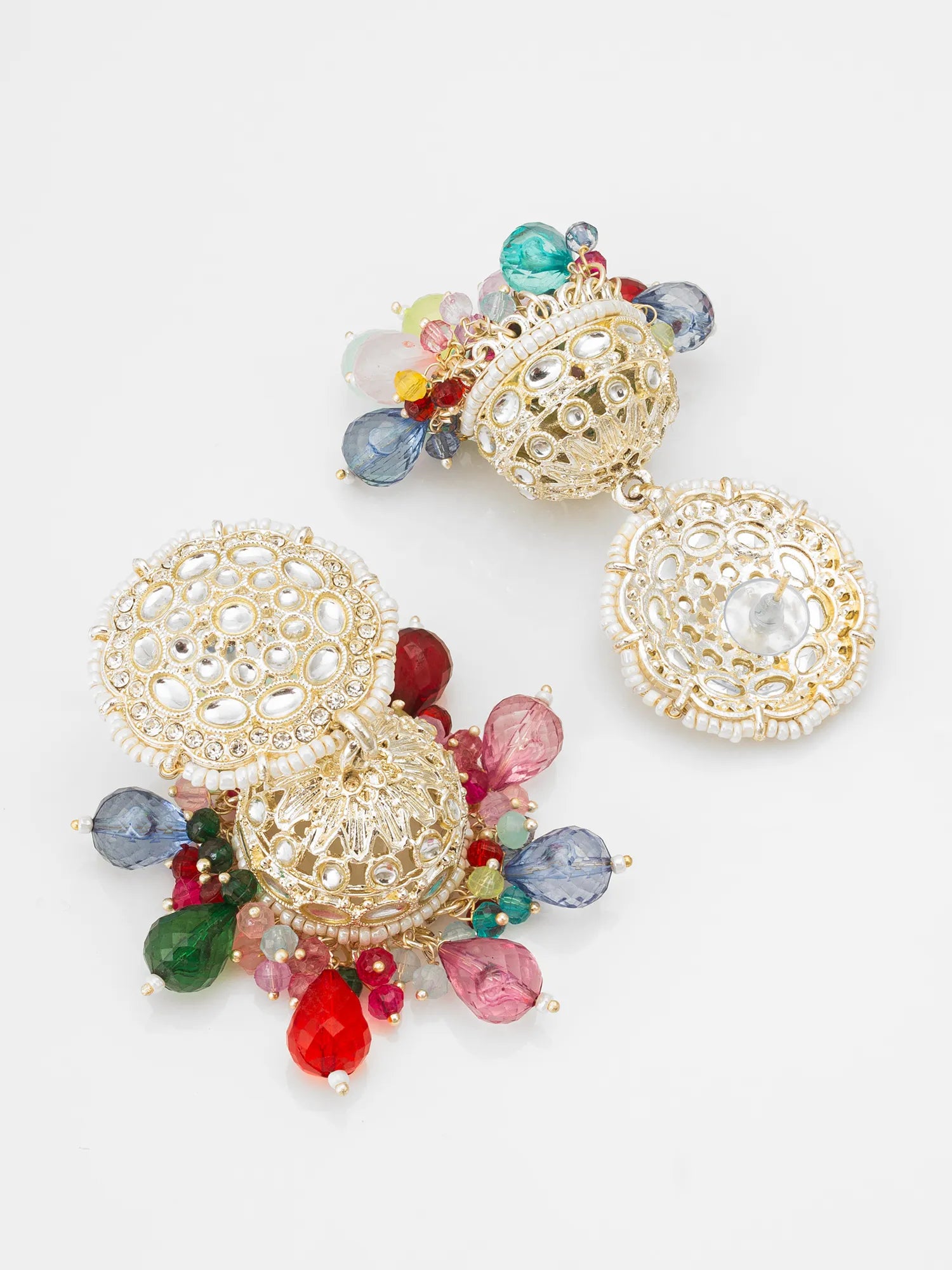 Colorful earrings with gold filigree design on a white background