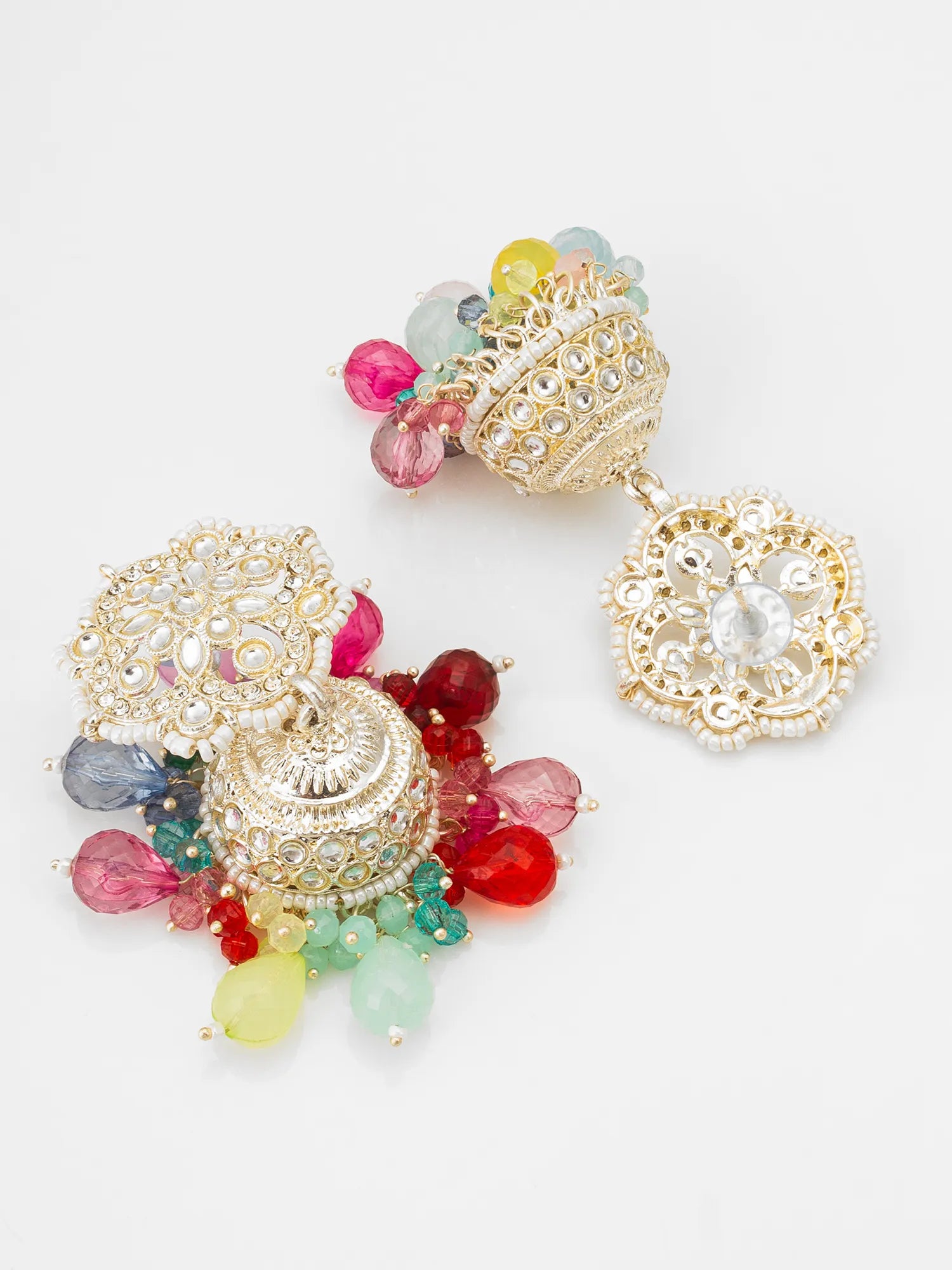 Colorful earrings with gold filigree and multicolored beads on a light gray background