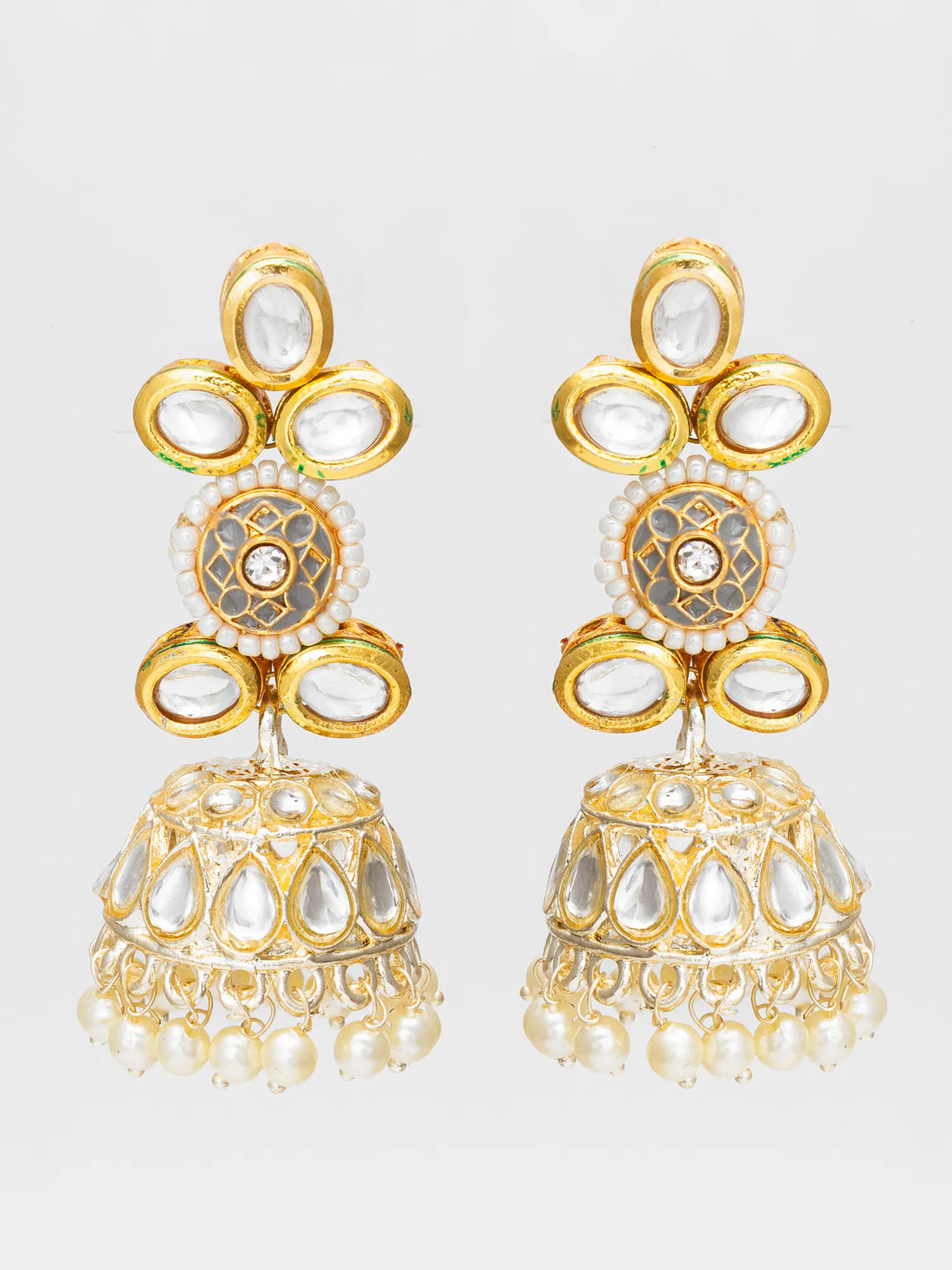 Kundan Jhumka Earrings On A Red Background