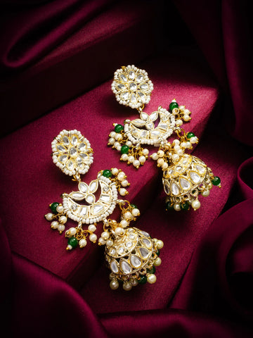 Jhumka Earrings On A Red Background
