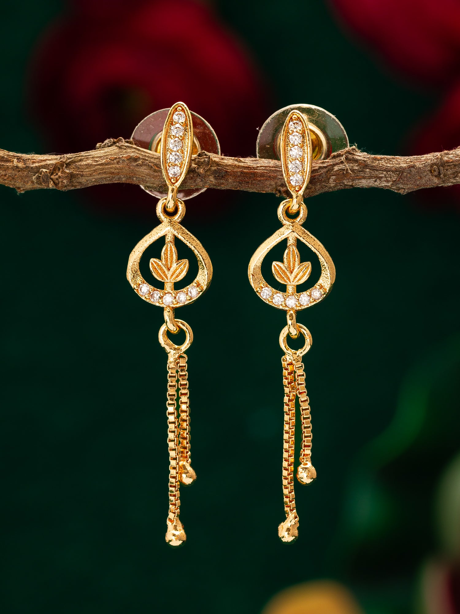 Aadita Gold Plated Leaf Motif Drop Earrings with Chain Tassels