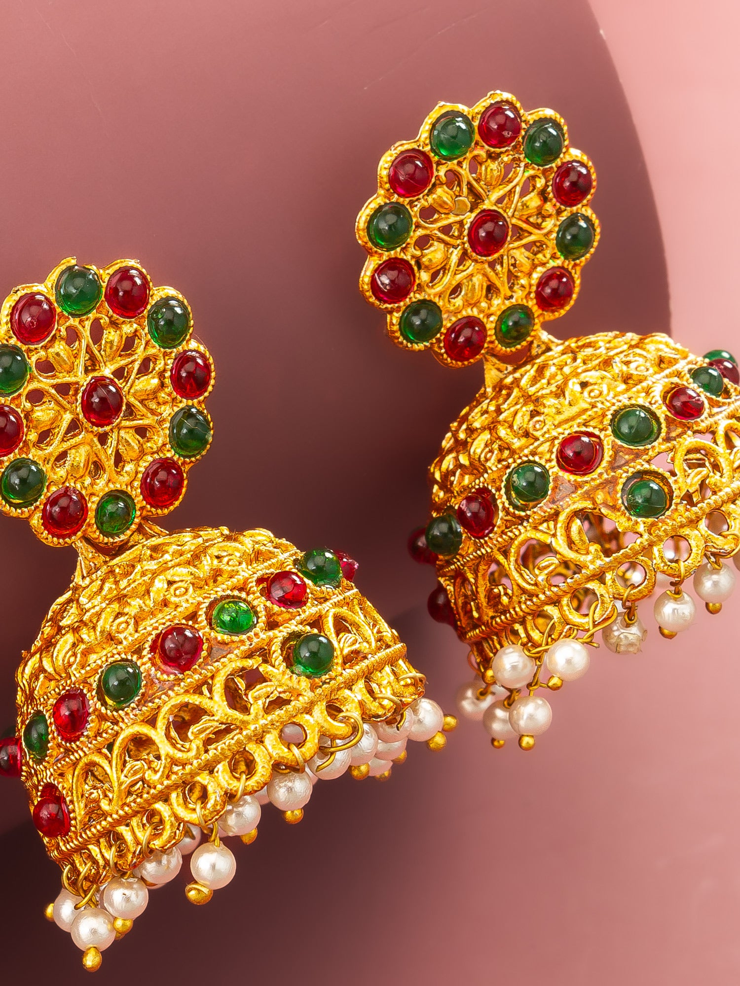 Aadita Gold Plated Traditional Jhumka Earrings with Red and Green Stones