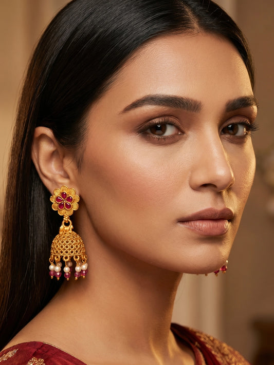 Aadita Gold Plated Floral Jhumka Earrings with Pink Stone Accents