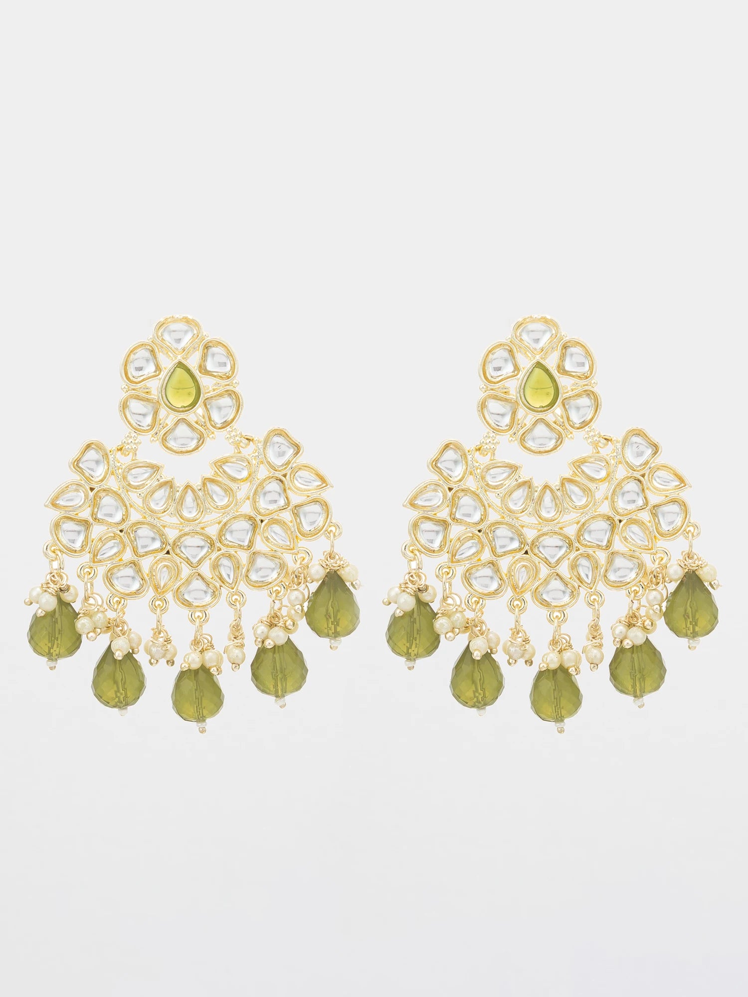 A pair of gold-toned Indian chandelier earrings decorated with clear stones and olive green bead drops, shown against a plain light gray background.
